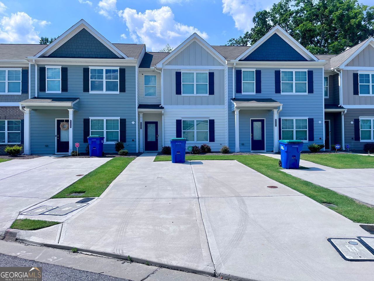 Welcome to 6087 Mallory Ridge - an immaculate, like-new 3-bedroom and 2.5 bath rental townhome offering modern comfort, style, and functionality. Built in 2023, this pristine property has been meticulously maintained and is truly move-in ready. Step inside to an open and airy floor plan filled with natural light and upscale finishes, including gleaming hardwood floors throughout the main level. At the front of the home, a versatile flex room awaits-perfect for a home office, creative studio, formal dining room, or whatever fits your lifestyle. The heart of the home is the stunning chef's kitchen, featuring granite countertops, sleek gray cabinetry, and a generous center island with an undermount sink-ideal for meal prep or entertaining. The kitchen flows effortlessly into a spacious family room with a cozy fireplace, creating a welcoming space to relax or gather with loved ones. Upstairs, the expansive owner's suite offers a peaceful retreat with ample space and privacy. The spa-inspired en-suite bath features a large walk-in shower, dual granite-topped vanities, and plenty of storage. Two additional bedrooms and a stylish hall bath with granite countertops complete the upper level. Enjoy a private backyard-great for quiet mornings or weekend barbecues-and take advantage of the home's unbeatable South Fulton location, with easy access to major highways, shopping, dining, and Hartsfield-Jackson Airport. If you're searching for a rental that combines modern design, convenience, and spotless condition, look no further.