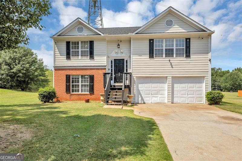 Welcome to this beautifully updated 3-bedroom, 2.5-bath home tucked away in a quiet and highly sought-after community just minutes from I-75, Eagles Landing Country Club, shopping centers, movie theaters, and a wide variety of dining options. From the moment you walk in, you'll notice the thoughtful updates that make this property truly move-in ready. The main level features an open and inviting layout with granite countertops, fresh paint throughout, and brand-new carpet that adds a warm and modern touch to every room. A full roof replacement was completed in 2022, providing peace of mind for years to come. The lower level offers incredible flexibility with two additional bedrooms and a full bath, creating the perfect space for guests, a home office, or even an in-law or teen suite. Whether you're entertaining friends or enjoying a quiet evening at home, this property provides comfort and style at every turn. Living here also means enjoying the many amenities included with the HOA. Take advantage of the sparkling swimming pool on hot summer days, challenge your friends to a tennis match, or spend time outdoors at the community playground. With so much to offer inside and out, this home is an ideal choice for buyers seeking convenience, comfort, and community all in one. Don't miss the opportunity to make this home yours. Schedule your private tour today and prepare to fall in love.