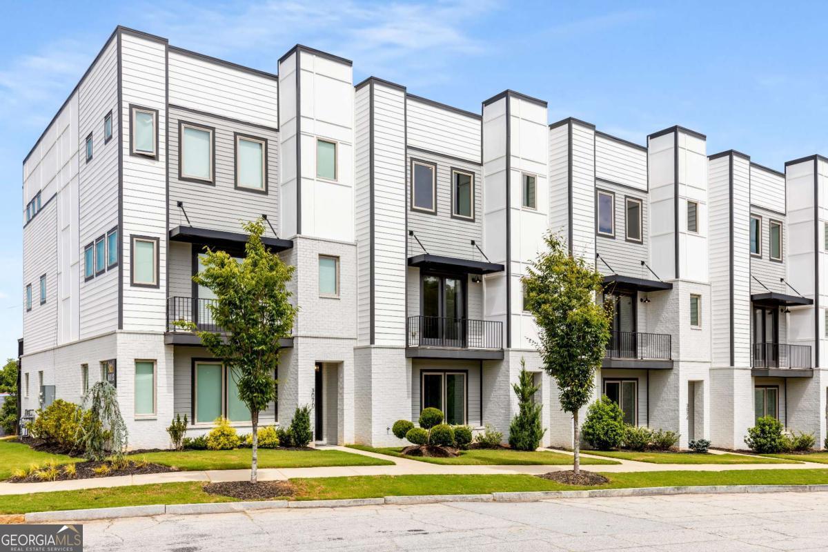 *TIME TO BUY!* The Mills at Scottdale is a boutique townhome community uniquely situated along the PATH in this popular and rapidly growing neighborhood! Whether you prefer to walk or bike, you are just minutes away from top dining and retail destinations in Avondale Estates and the City of Decatur, with connectivity to the Beltline via the PATH. This convenient location provides limitless options for an intown lifestyle in any direction! 3076 Kelly is beautifully appointed, move-in ready, and one of only TWO remaining homes! Enjoy a flexible floor plan, offering two primary suites on the upper level, plus a third bedroom with a full bath on the entry level-perfect for guests, roommates, home office, or multi-generational living. On the main living level, you'll enjoy a light-filled open concept space with wood flooring, distinct living and dining areas, and a stylish centered kitchen. The kitchen features elegant white cabinetry, a tiled backsplash, a center island with quartz countertops, gas cooking, and a full stainless steel appliance package, including the refrigerator. The inviting living room is anchored by a gas fireplace and opens to the rear deck, ideal for entertaining. For added convenience, a powder room completes this level. Upstairs, you'll find two large primary suites, each with walk-in closets, double vanities, and beautifully tiled showers with glass enclosures. Enjoy the convenience of an attached two-car garage and abundant storage throughout. The Mills at Scottdale also offers a newly fenced greenspace/dog park, located adjacent to the PATH, so your furry friends can enjoy their new home as much as you do! This community is surrounded by growth and exciting new developments, including the Avondale Town Green, the expansive DeKalb Farmers Market, and the nearby redevelopment of North DeKalb Mall. Its proximity to Emory University, the CDC, CHOA, Agnes Scott College, Stone Mountain Park, and MARTA makes it a highly desirable location for both work and play. With HOA fees of just $150 per month, you will enjoy low maintenance living in a vibrant community. Or purchase as an investment for your rental portfolio and build equity. No rental restrictions! 2-10 New Home Warranty provided by Seller.