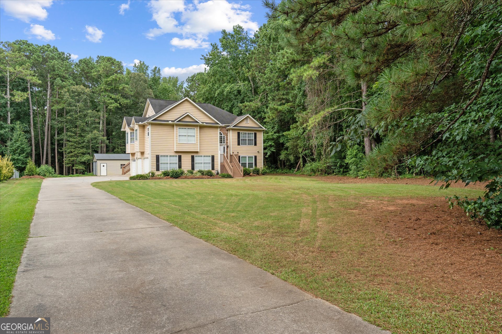 So much space, style, and versatility-this one has it all! This beautifully updated 5-bedroom, 3-bath home is completely move-in ready and offers the perfect layout for multi-generational living, guests, or an in-law suite. Downstairs, you'll find a fully finished walk-out basement with its own private kitchenette, laundry room, 2 spacious bedrooms, and a full bath-ideal for extended family, older kids, or visitors. Upstairs features 3 large bedrooms and 2 full baths, plus a gorgeously remodeled kitchen that checks every box: huge island, tons of counter space, soft-close cabinetry, updated lighting, and modern finishes throughout. The cozy living room includes a beautifully updated fireplace, and the covered back deck is the perfect spot to relax and enjoy your private, nearly one-acre lot. Need storage or extra space for hobbies, tools, or toys? You'll love the large detached storage building with dual garage doors, in addition to the home's three-car basement garage-perfectly positioned for separate entry to the lower-level suite. The location of this home is perfect being less than a mile to Alexander High School and just a short drive to I-20 providing easy access to shopping, dining, and more. It's rare to find this much space, flexibility, and value all in one place-don't miss your chance to make this incredible home yours!