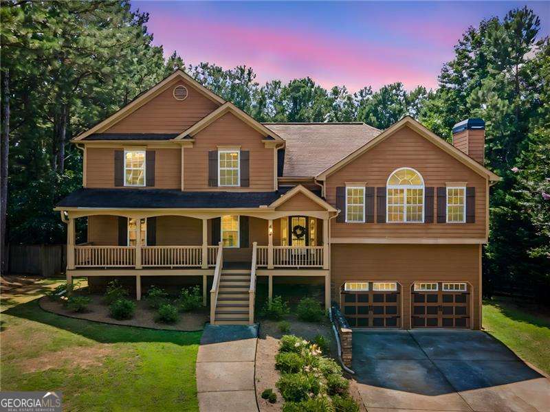 Extremely well maintained, HUGE family home now available!! Room for everyone and then some!! Split level floorplan features family room with fireplace and vaulted ceilings, eat-in kitchen with granite counters and TONS of storage space, plus formal dining room area. Mid-level offers an additional family room / rec room area, plus bedroom and full bathroom and screened porch. Lower level offers an additional bedroom and full bath, plus large storage room that is heated and cooled. Master bedroom has a sitting room and bathroom with dual vanities, whirlpool tub, separate shower, plus TWO closets. All secondary bedrooms are nice sized. Garage has super high ceilings and storage room. Back deck has sunsetter awning! Buried propane tank for fireplace and stove/oven. HUGE level fenced in backyard has been meticulously maintained. There are peach trees and blackberries, and about a mile walk to the lake. Lot backs to wildlife preservation! Quiet neighborhood tucked into the west side of Canton. Close to the lake , Sweetwater Creek campground, and only 10 minutes to shopping and restaurants. Show today!!