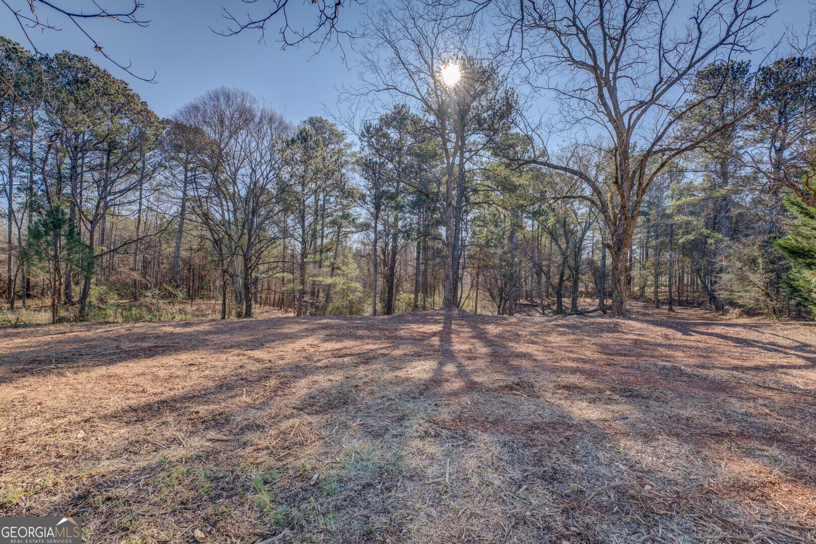 ** Come Build Your Dream Home in Sought After Social Circle** 5.00 gorgeous acres with beautiful Hardwoods as well as over 200 ft of road frontage - Seller has had work done to show multiple home sites whether you want a basement lot or slab with tons of privacy and has cleared a road/path around property to access with ATV - This property is located in Zone 5 of Walton County so you can choose either Social Circle City Schools or Walton County Schools - Convenient to Monroe, Madison and Covington - Agents bring your picky buyers to see this property!! There's so many possibilities with this land