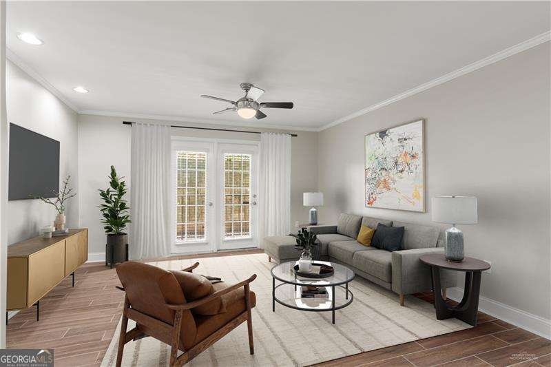 Welcome home to this beautifully updated 2-bedroom, 2-bathroom condo in the highly desirable Habersham of Buckhead community. This light-filled residence showcases stylish wood-look tile flooring throughout, smooth ceilings with recessed can lighting, and elegant crown molding, creating a modern and polished feel. The open layout flows seamlessly from the spacious living room into the dining area and kitchen, perfect for both everyday living and entertaining. The renovated kitchen boasts modern finishes, while both bedrooms provide generous closet space and updated baths for comfort and convenience. Additional upgrades include a new water heater and a covered parking space for added value and peace of mind. Relax on your private balcony or take advantage of the community's pool and amenities. Unit is virtually staged. Located in an unbeatable Buckhead location, you're just minutes from Chastain Park, Bar Taco, Superica, Johnny's Hideaway, and some of Atlanta's best shopping, dining, and entertainment options. Move-in ready and full of charm-this condo offers the best of city living in one of Atlanta's most sought-after neighborhoods.