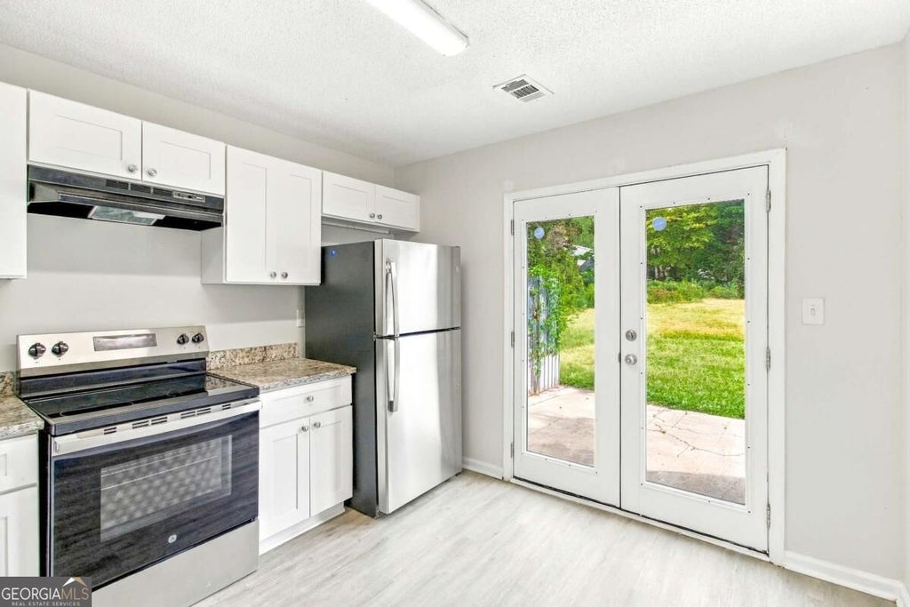 Photo of 7980 Woodlake Drive, Riverdale, GA 30274 (MLS # 10853283)