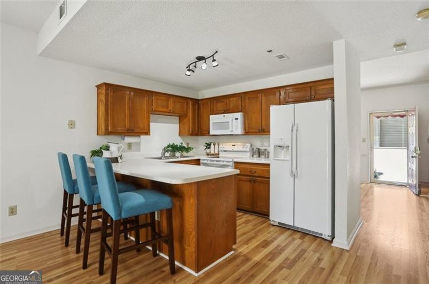 Welcome to your urban oasis in the heart of Alpharetta! This is your opportunity to get into a turnkey Townhouse style Condo in Milton High School under $300k! This 2 bedroom, 2.5 bathroom condo offers the perfect blend of modern sophistication and comfort. Minutes to all that Downtown Alpharetta has to offer and walking distance to Wills Park, this residence provides unparalleled access to Alpharetta's charming city life.  Step inside and be greeted by an open-concept living space. The living and dining areas seamlessly flow together, creating an ideal setting for entertaining guests or enjoying cozy nights in by the fireplace. Enjoy morning coffee on the gated back deck. Don't need a formal dining space? It also makes the perfect office or playroom. There is no carpet in this unit! The upstairs bedrooms offer a roommate style floor plan and the primary suite has a deck conveniently located off of it.  Don't miss the opportunity to make this exceptional condo your new home in one of the hottest North Atlanta Suburbs. Welcome Home!
