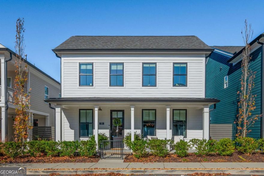 Welcome to 51 Little Magnolia Lane, a beautifully upgraded 4-bedroom home nestled in the picturesque and one-of-a-kind community of Harmony. This rare "Charleston" floor plan offers the ultimate in comfort and convenience with a primary suite on the main level, a cozy upstairs loft, and three additional generously sized bedrooms. Step inside from the inviting covered front porch to an open-concept layout featuring a bright and airy living room, dining room, and kitchen-perfect for both everyday living and entertaining. The living room is bathed in natural light through large windows, and the cozy gas log fireplace adds a touch of warmth and ambiance. Gorgeous luxury vinyl plank flooring flows throughout the main floor. The chef-inspired kitchen boasts white cabinetry, upgraded light fixtures, a large island, sleek Quartz countertops, and a spacious pantry. The expansive primary suite is a true retreat, featuring a custom accent wall, large windows, a walk-in closet, and en suite bathroom with dual vanities and a beautifully tiled shower. Upstairs, you'll find a cozy loft area perfect for relaxing or reading, along with three additional large bedrooms (perfect for a home office!) and a full bathroom with dual vanities and a tub/shower combo. This home is designed with convenience in mind, featuring two laundry closets-one on each level. Outdoors, you'll enjoy a private, fully fenced courtyard-ideal for al fresco dining, entertaining, or simply enjoying the fresh air. The welcoming covered front porch offers the perfect spot for sipping your morning coffee or unwinding in the evening. Additional highlights include a 2-car rear-entry attached garage, main floor half bathroom, upgraded hardwoods on the stairs, luxury vinyl plank flooring upstairs, and energy-efficient windows, doors, and insulation, ensuring comfort year-round. Situated in the thoughtfully designed Harmony community, this home is just steps from the community pavilion, lush green spaces, trails, a garden, and even an apiary-all built around the charming city hall. Designed by the renowned Lew Oliver, Harmony offers a unique atmosphere that blends charming homes and thoughtful details with the beauty of nature. This upgraded home is better than new! Schedule your private showing today and experience the exceptional lifestyle Harmony has to offer.