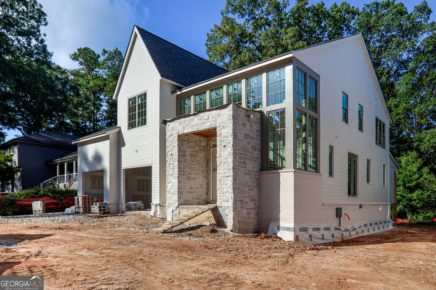 Introducing Bedrock Homes newest project in Chamblee - Millgrove. 1 home is now under contract, and we are excited to bring to market the final 2 homes! Thoughtfully designed floor plans and custom-curated finish specifications. All 3 homes are under construction with planned closing dates in October. Front elevations boast a blend of brick, stone and smooth siding with light color schemes and soft warm tones. Open and functional interior spaces brightened with large windows and slider doors. The homes feature 10 foot ceilings on the main floor and 9 foot and vaulted ceilings on the upper. Full guest suites, mudrooms and powder rooms on the main levels in addition to walk-in pantries, entertainment bar spaces, and a full JennAir appliance packages including a 42" built-in refrigerator. Covered back porches offer a 2nd fireplace and overlook wonderfully landscaped backyards with privacy fencing. The owner's suites feature vaulted ceilings, separate tubs, walk-in showers and 2 generously-sized closets. Wide plank white oak flooring throughout with tile in the full baths and laundry. Full, daylight basements provide almost 2000 additional square feet for future finish. Easy access to incredible dining options, shopping, grocery, highways, Chamblee Rail Trail and Sexton Woods tennis courts, playground and other amenities!