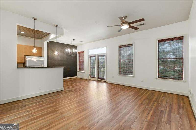 Live in the heart of it all at Duo Lofts! This freshly updated 2 bed, 2 bath condo offers the perfect blend of modern city living and industrial loft charm. Featuring fresh paint, durable LVP flooring throughout, and stylish new lighting, this move-in ready home brings together modern updates and industrial charm with its brick accent wall and open-concept layout. Enjoy a true primary suite with a walk-in closet and spacious bathroom, plus the convenience of in-unit laundry. Two private, covered parking spots are included, an in-town luxury! The community offers top-tier amenities like a private pool, well-equipped fitness center, and secure entry, all with a low monthly HOA. Unbeatable location just minutes from Mercedes-Benz Stadium, State Farm Arena, Georgia World Congress Center, CNN Center, the Georgia Dome site, and Underground Atlanta. Whether you're commuting, catching a game, or exploring the city, everything you need is right outside your door.