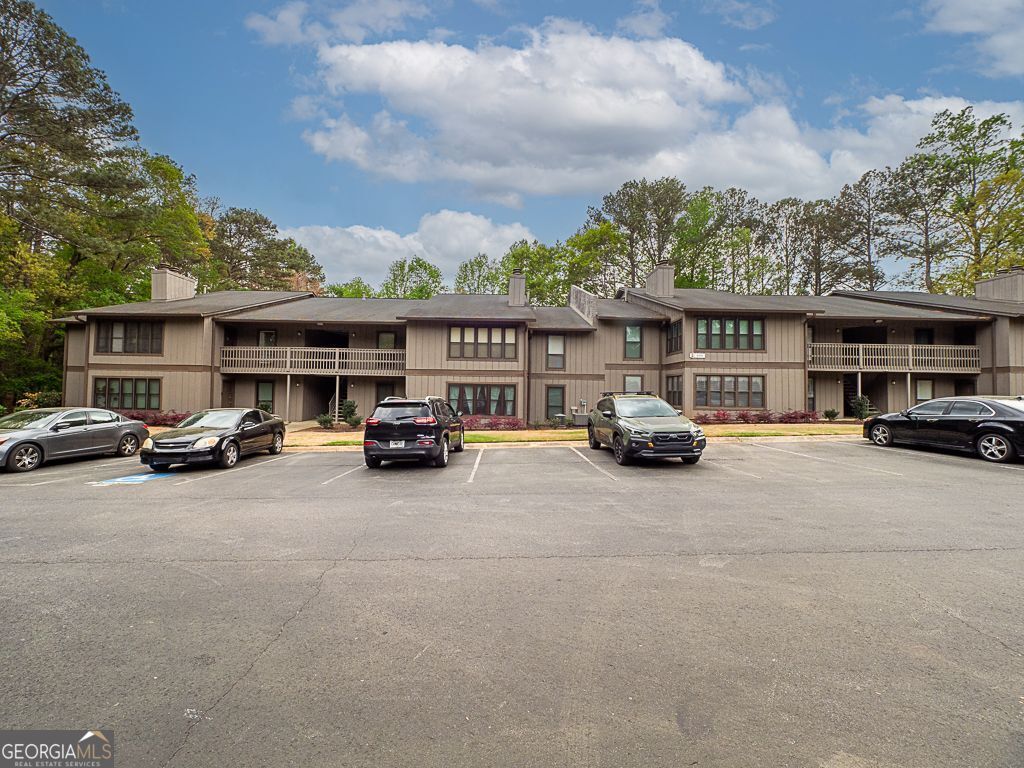 Welcome home to this beautifully maintained 2-bedroom, 2-bathroom condo in the heart of East Cobb! Nestled in a quiet & peaceful community with top-rated schools, and just minutes from highways, shopping, The Battery and everywhere you want to be! Lovely open floor plan with a spacious living room, kitchen with white cabinetry, stainless steel appliances, and dining area. Sunroom has an incredibly serene view of the trees and nature--it's the perfect spot for a morning coffee or to wind down at the end of the day. Both bedrooms offer a private bathroom and walk in closet and a perfect roommate setup with space between. Chimney Trace offers lovely amenities including saltwater pool, communal dog walking areas, and green space. DonCOt miss your chance to own this gem in East Cobb!