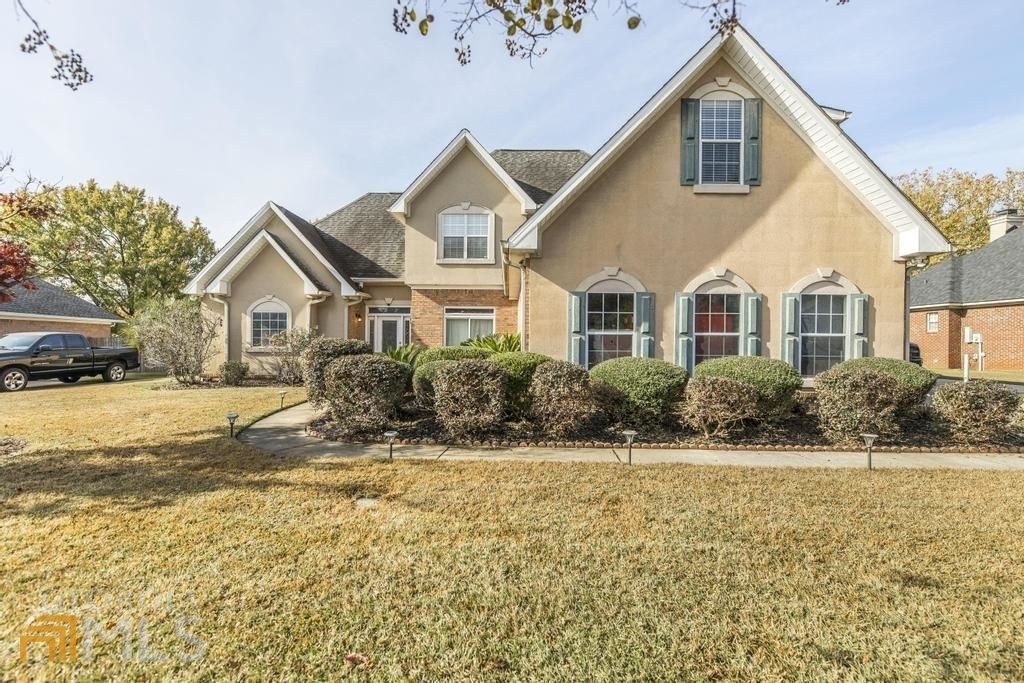 This 4/2.5 baths won't last long! In-ground salt water pool, work shop, huge great room for your entertaining, living room, several pantries to store things in your beautiful kitchen, master bedroom with lots of closets on the main floor and so much more!