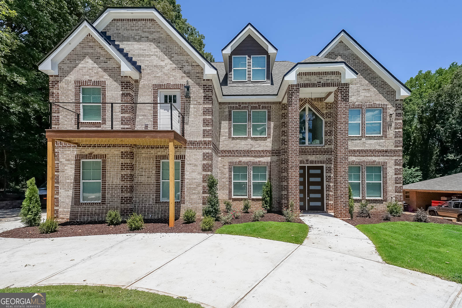 Step into this stunning 6-bedroom, 6-bath new construction home in the heart of Lilburn-complete with a bonus room to fit your lifestyle! Nestled on a premium lot with no HOA, this home offers the perfect blend of luxury, comfort, and freedom. The open-concept kitchen, featuring a fridge and high-end finishes, flows effortlessly into a spacious living area-ideal for entertaining. Upstairs, the oversized master suite offers a private retreat with a double vanity, walk-in closet, and a luxurious soaking tub. For added convenience, a guest suite with its own ensuite bathroom is located on the main level. Designed with Southern charm and modern functionality, this home is loaded with upgrades and includes all essential appliances: washer, dryer, fridge, stove, and microwave. Located just minutes from I-85, this is your chance to own a truly exceptional property. Schedule your private tour today!