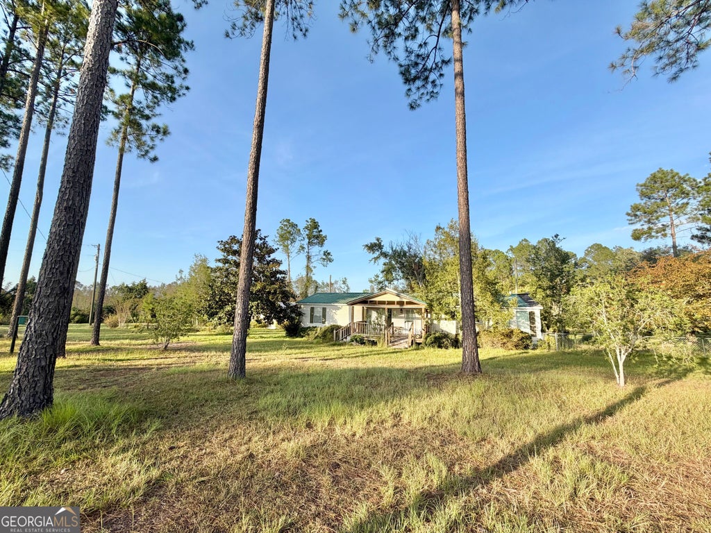 Photo of 698 Pat Dixon Road, Hazlehurst, GA 31539 (MLS # 10848471)