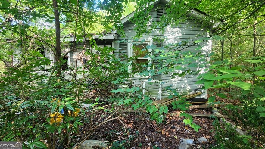 Prime Commercial Opportunity - Fixer-Upper on Spacious Lot    Endless potential awaits with this abandoned home on a commercial lot. Perfect for redevelopment or a business venture, the property offers excellent visibility and high-traffic exposure. Structure requires full renovation and is sold as-is, making it an ideal project for investors or entrepreneurs. Bring your vision and transform this space into a thriving business location! CALL/TEXT OR EMAIL FOR QUESTIONS OR TO SUBMIT YOUR OFFER! MEGANW@TRITORI.CO