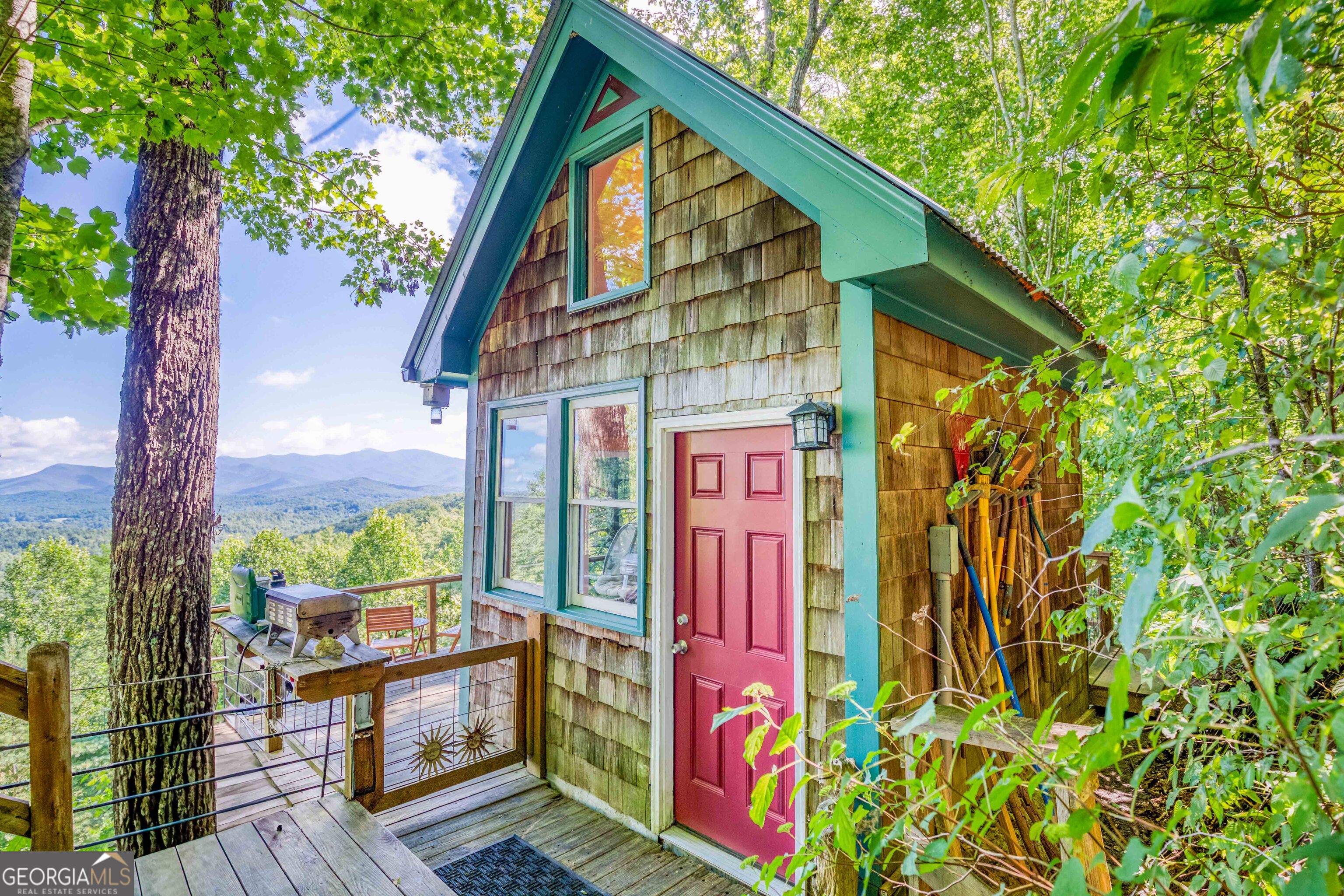 Welcome to your own piece of paradise! This property offers unparalleled mountain views that stretch over 20 miles. This charming cabin is ideal for a weekend getaway, or you could build your dream mountain home here, as a septic system is already installed. Imagine enjoying your morning coffee on the oversized back deck while watching eagles soar overhead. This is an amazing property you won't want to miss!