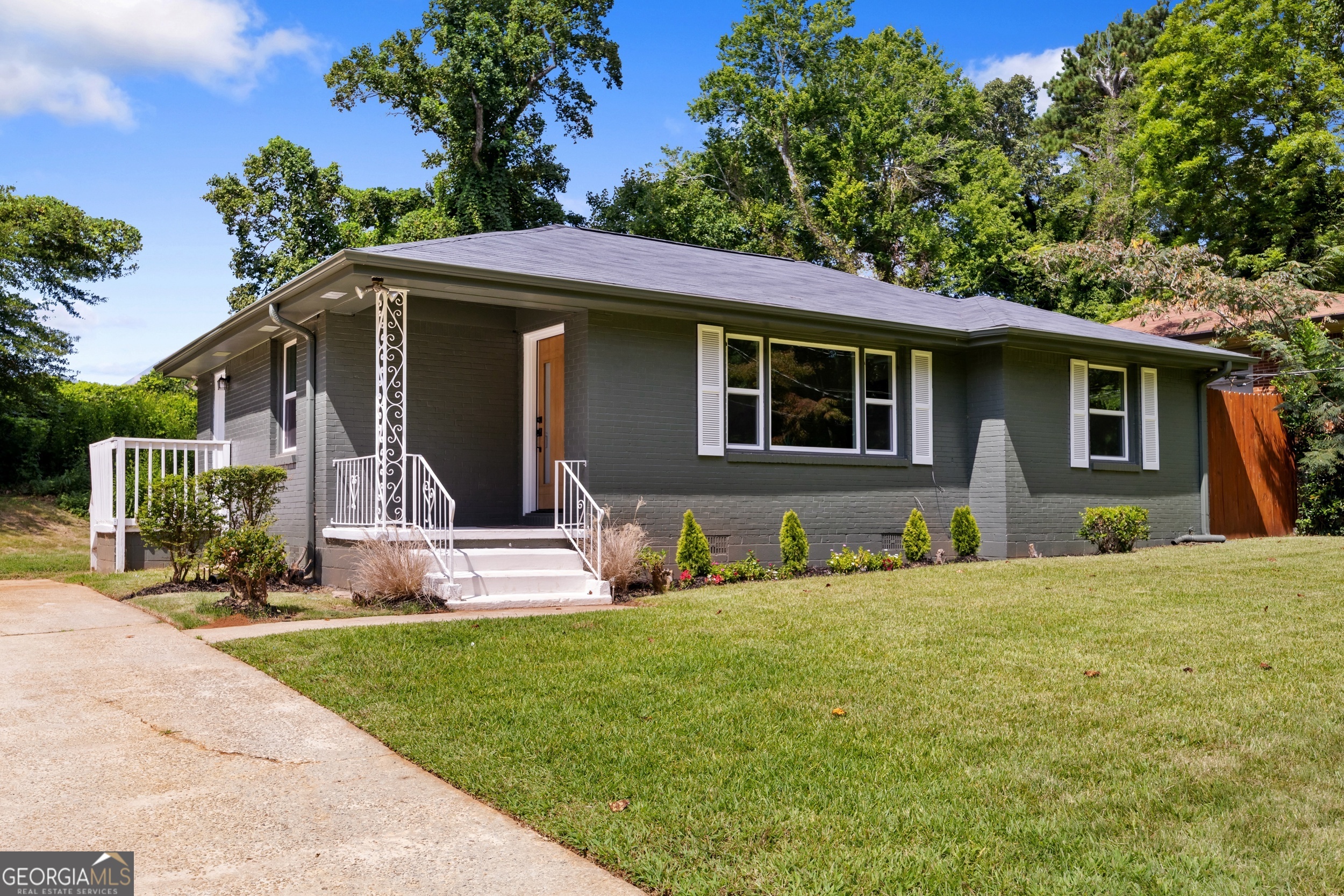 Welcome to this beautifully refreshed 3-bedroom, 2-bath home where comfort meets style. Thoughtfully updated with new flooring, HVAC, plumbing, and electrical, this home offers peace of mind and modern convenience. The open concept layout is perfect for both everyday living and entertaining, with natural light pouring in to highlight the warm, natural stained hardwood floors throughout. The kitchen features brand new appliances, offering a sleek and functional space to prepare meals. Conveniently tucked away, you'll find a dedicated area for a stackable laundry unit, making the most of every square foot. The hall bathroom showcases open shelving for linens and a tub accented with timeless basketweave-pattern tiles. In the primary suite, the bathroom boasts a tall, spa like shower with eye-catching chevron style tiles. Outside, the home's exterior is painted in a sophisticated pewter green a modern, muted shade that blends the calmness of sage with the depth of gray offering inviting curb appeal. A spacious front lawn and expansive backyard provide endless possibilities, from gardening to building your dream outdoor oasis. With no HOA, you'll enjoy both freedom and flexibility in how you make this home truly yours.