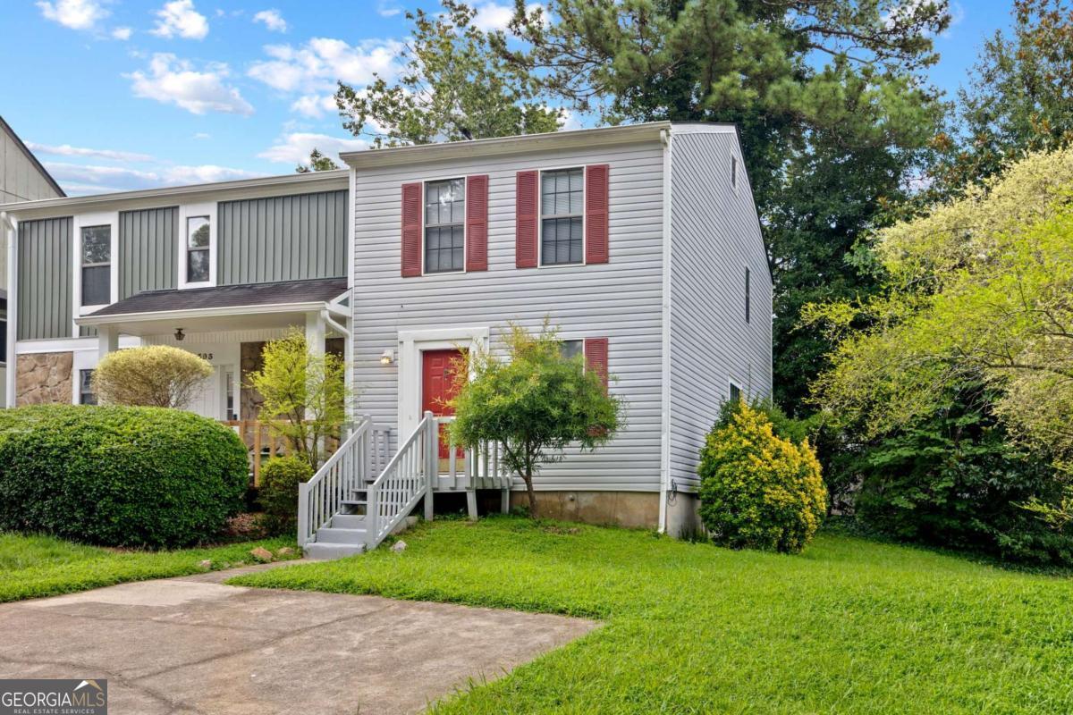 End-unit 2BR home less than 1 mile to The Battery & Truist Park, Cumberland Mall, with quick access to I-285 & I-75, making work, entertainment, and city commutes a breeze. The main level features a cozy living room with fireplace, a flexible dining/office area, an eat-in kitchen, and a convenient powder room. Upstairs are two well-sized ensuite bedrooms, each with its own full bath; great for roommates, guests, or a private office. Relax or entertain on the back deck. Two private parking spaces sit right at your front door. FEE SIMPLE WITH NO HOA. Quiet, convenient, and move-in ready; ideal for investors or first-time buyers who want location, flexibility, and value.