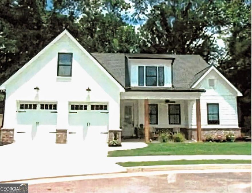 Welcome to Mill Farm Place, a small neighborhood of 13 modern farmhouse style homes, less than a mile to downtown Monroe and Monroe Golf &  Country Club! LARGER THAN IT LOOKS Y'ALL - IT'S 2533 SF!! This custom-built home with brick and Hardie Plank Siding was constructed in 2024 with 4 bedrooms, 3 full bathrooms and a bonus room with plenty of walk-in attic storage. There is  water resistant bamboo flooring throughout the living spaces and bedrooms. No carpet in this home! Primary suite on main level with dual vanity and large shower with dual showerheads, linen closet and custom walk-in closet. Two additional bedrooms and full bathroom on main level. Upstairs, you will find a large bonus room, full bathroom and bedroom with a large walk-in closet. Living room has a cozy gas fireplace with beautiful reclaimed wood mantel and wood beam accents on the high ceiling. Enjoy a chef's kitchen with quartz countertops, a large island with additional seating, a 48" Thor gas stove with 2 ovens, pantry with custom shelving, stainless steel appliances and large farmhouse sink. Dining space opens to a screened in porch for relaxing and open deck for grilling - natural gas hookup for grill. Fully fenced in, low maintenance backyard. Irrigation system in place for both the front and back yards. Front facing, double garage for easy parking of your vehicles and golf cart, already equipped with an EV plug for at-home charging! This plan is perfect for an empty nester, with separate private space for guests, or a family. Atha ES, Youth MS, Walnut Grove HS.  Community mail kiosk, so no individual mailboxes on properties.    **$4500 Buyer Credit for closing costs/buy down with approved lender!!