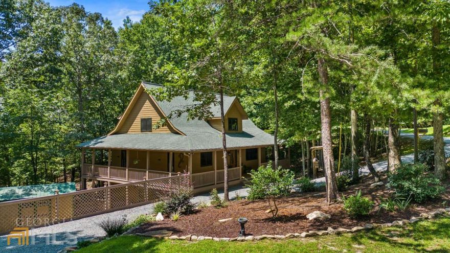 Welcome to your very own private mountain retreat sitting on double lot of almost two acres. This stunning home is ready for full-time living or quick getaways with rental potential. Spend your mornings enjoying coffee on the large wraparound porches and the afternoon walking the trails down to Carter's Lake. With this home, you have a seller willing to pay $10k in closing cost and a buyer's home warranty with a suitable offer. So much nature surrounds this four bedroom, three bath home with a full finished basement. You are sure to love the partially screened in wraparound porch, private owneras suite balcony, and basement terrace deck as well. Natural hardwood floors and ceilings, stacked stone gas fireplace, tiled bathrooms, granite countertops, and stainless steel appliances are just some of the upgrades and features youall notice. On the property youall find a storage building and custom detached carport or shop. The additional lot would be perfect for a future guest house or for recreational use and has electricity and water approval, with a septic tank in place. It is ready for your future plans and is full of potential. Additional features include: new HVAC system September 2021, hardy board siding, two laundry hookups. plenty of room for RV and boat storage, new stainless steel appliances, and many recent lot upgrades. The serene setting awaits your arrival, so donat hesitate! Come get a glimpse of this rare find.