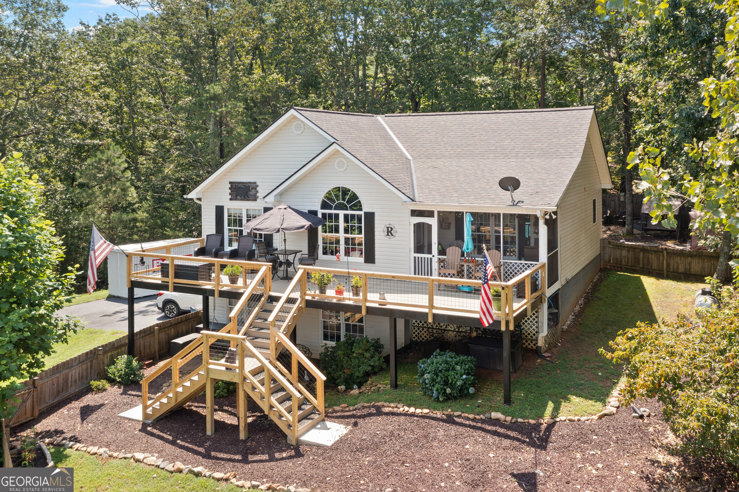 Enjoy breathtaking mountain views from the brand-new decks of this beautifully updated 3-bedroom, 3-bath home, perfectly situated in Dahlonega. Step inside to an inviting open-concept living and dining area featuring vaulted ceilings, rich granite countertops, and stainless steel appliances that make the kitchen. A spacious media room/office offers flexible space for remote work, entertainment, or hobbies. Pool table game room also on basement level. The screened-in porch and fenced yard provide the perfect blend of indoor-outdoor living-ideal for relaxing or entertaining while soaking in the scenery. Whether you're searching for a full-time residence or a mountain getaway, this home checks all the boxes.