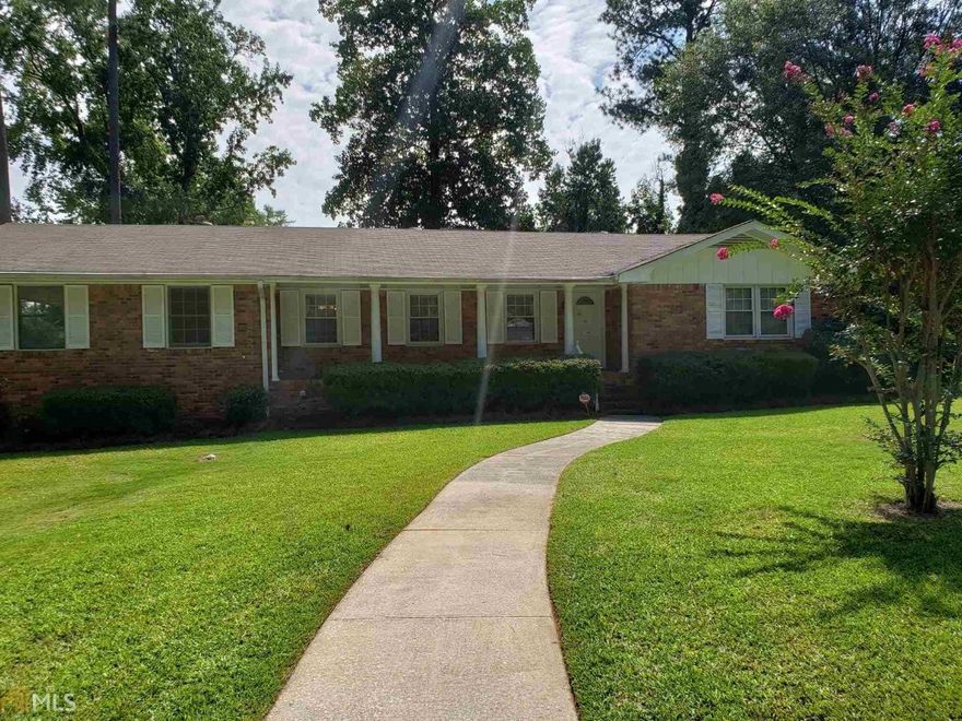 Immaculate home on a corner lot.  4 Side brick, fenced-in back yard.  Stainless steel refrigerator, wall oven, rare masonry fireplace, large utility room in double carport.