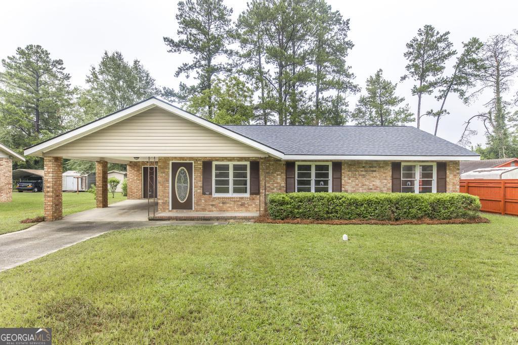 JUST LISTED! STUNNING NEWLY REMODELED HOME - MOVE-IN-READY! Step into this gorgeously remodeled all brick, ranch style home, where every detail has been thoughtfully upgraded. This property offers the perfect blend of style, comfort, and convenience. Features You'll Love: Brand new kitchen with new modern countertops, shaker style cabinets & stainless-steel appliances. Large kitchen island with plenty of room for separate kitchen dining table. New luxury vinyl plank flooring throughout. Remodeled bathroom with modern sleek fixtures. Fresh interior paint throughout. New roof. Metal shed with oversized door and ramps for extra storage. Private backyard perfect for entertaining, play time or relaxing. Separate laundry/mud room with easy access to kitchen or carport. Conveniently located near schools, parks, shopping, and major highways. Whether you're looking for your first home or your forever home, this one check all the boxes. Schedule a showing today and fall in love with your future home! * The preferred lender for this property is offering $1,000 towards closing costs and a free appraisal. Call for details. *