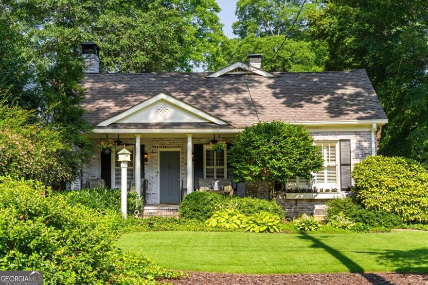 Step back in time with this charming 1920s home, perfectly situated just blocks from historic Marietta Square. Imagine starting your weekend with a stroll to the local farmers market, watching fireworks from your own front lawn on the 4th of July, immersing yourself in year-round festivals, and enjoying all the dining, shopping, and community events that make the Square so beloved.  Inside, this four bedroom, two bath home radiates warmth and character with original hardwood floors, millwork, and a gas log fireplace. The kitchen is a true heart of the home - a space that invites you to simmer a pot of soup or savor your afternoon tea. Outfitted with classic white cabinetry, new walnut butcher block counters, quartz-topped custom island, and abundant natural light, it's a kitchen where memories are meant to be made.  The primary suite occupies the second level and offers a private retreat with a full bath, while the finished lower basement level provides flexible space for a home gym, media room, or casual hangout - plus ample storage. Outdoors, the charm continues with a beautifully landscaped yard, a welcoming front porch perfect for morning coffee, and a detached two-car garage.  This is more than a home. It's a lifestyle steeped in history, community, and everyday comfort, all within steps of the vibrant Marietta Square.  Additional upgrades and features include:  Updated light fixtures, new interior paint, new HVAC system with EcoBee thermostats, tankless water heater, new garage doors and wall panels, and full irrigation system with new front sod.