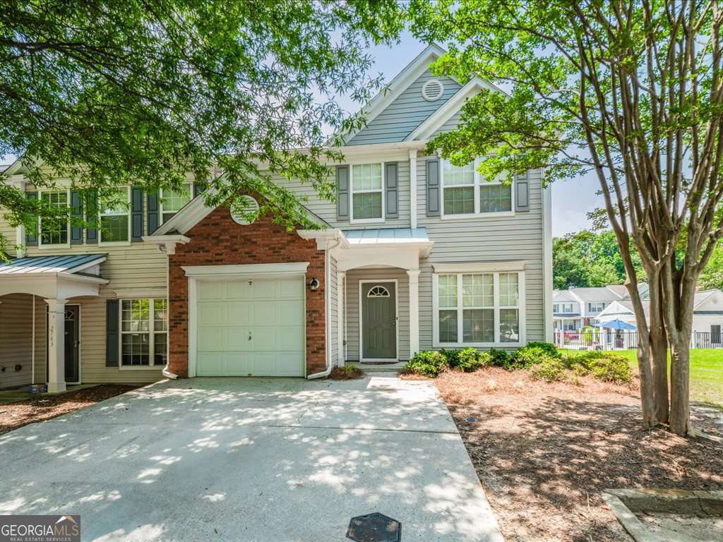 Beautiful End-Unit Townhome with Natural Light, Prime Location, and Pool Views! Welcome to this beautifully maintained end unit townhome with natural light, prime location, pool view, and 1 car garage. Step into a welcoming foyer that opens to a spacious formal dining area - perfect for entertaining. The bright fireside living room flows seamlessly into the eat-in kitchen, featuring granite countertops, stainless steel appliances, and direct access to a private porch with great views of the community pool. Upstairs, you'll find two spacious guest bedrooms that share a full bathroom with updated tile flooring. The oversized primary suite with walk-in closet is a peaceful retreat with an ensuite bath that includes a double vanity, soaking tub, separate shower, and new tile flooring. Enjoy an abundance of natural light throughout the home, and appreciate the incredible convenience to restaurants, Costco, top-rated schools, and easy access to GA-400. This move-in-ready home truly has it all - don't miss your chance to live in one of the area's most desirable communities!