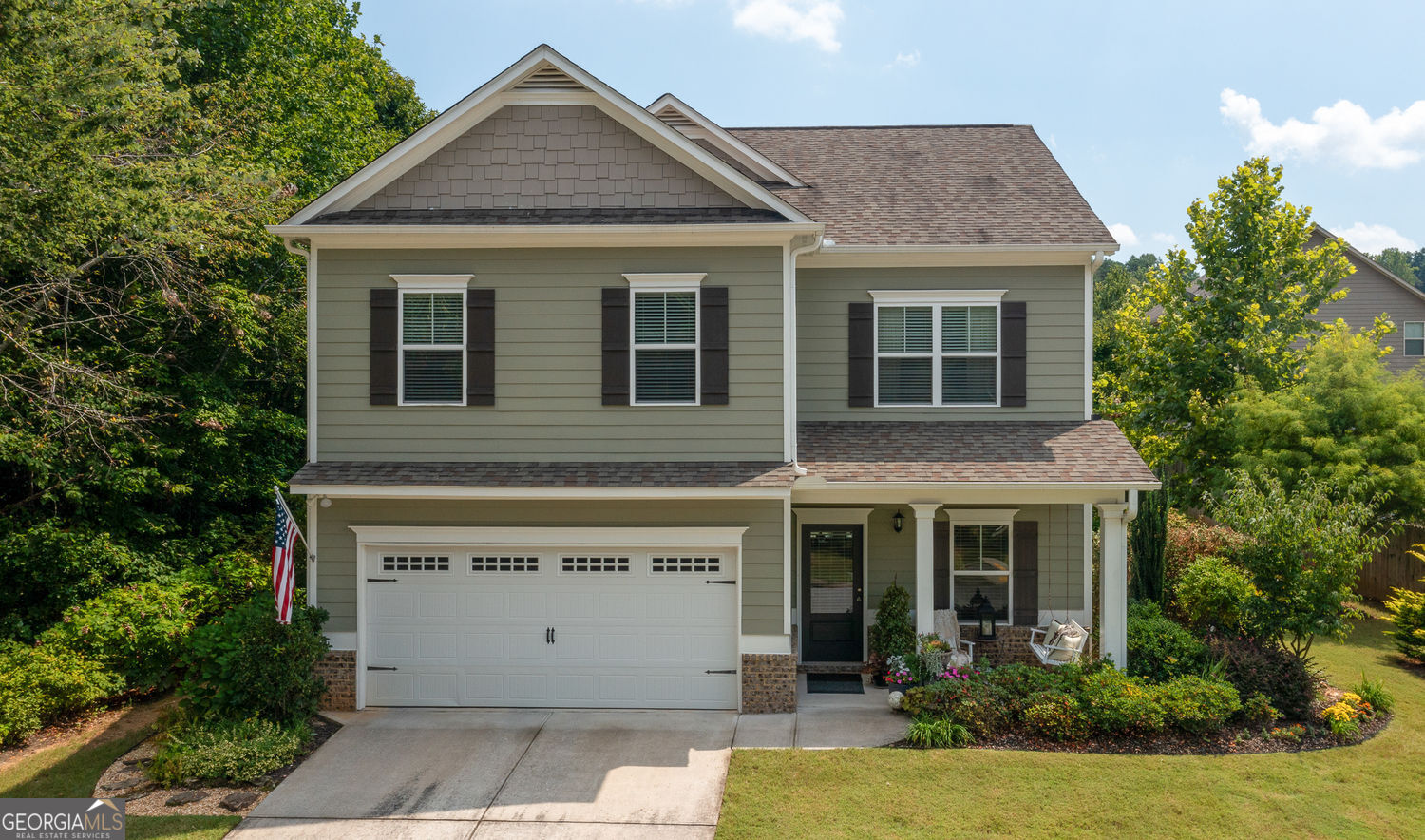 This beautiful home offers impressive curb appeal and a flowing open floor plan, perfect for both entertaining and everyday living. A welcoming foyer sets the stage for the spacious layout ahead. On the main level, enjoy a formal dining room, a bright family room with a cozy fireplace and a wall of windows that fill the space with natural light. Thoughtfully designed kitchen with tile backsplash, a generous eat-in bar, and a built-in desk area.The primary suite is a true retreat, featuring elegant tray ceilings and a spacious layout with a sitting area. The ensuite bathroom boasts a double vanity, separate tub and shower, and a large walk-in closet. Rounding out the upstairs are three roomy secondary bedrooms, a full bathroom, and a laundry room for added convenience. Step outside to the backyard sanctuary, where the breakfast room opens to a charming patio surrounded by lush landscaping. Stacked-stone flower beds, stepping-stone pathways, and a dedicated sitting area create a private courtyard feel, offering tranquility and natural beauty right at home.