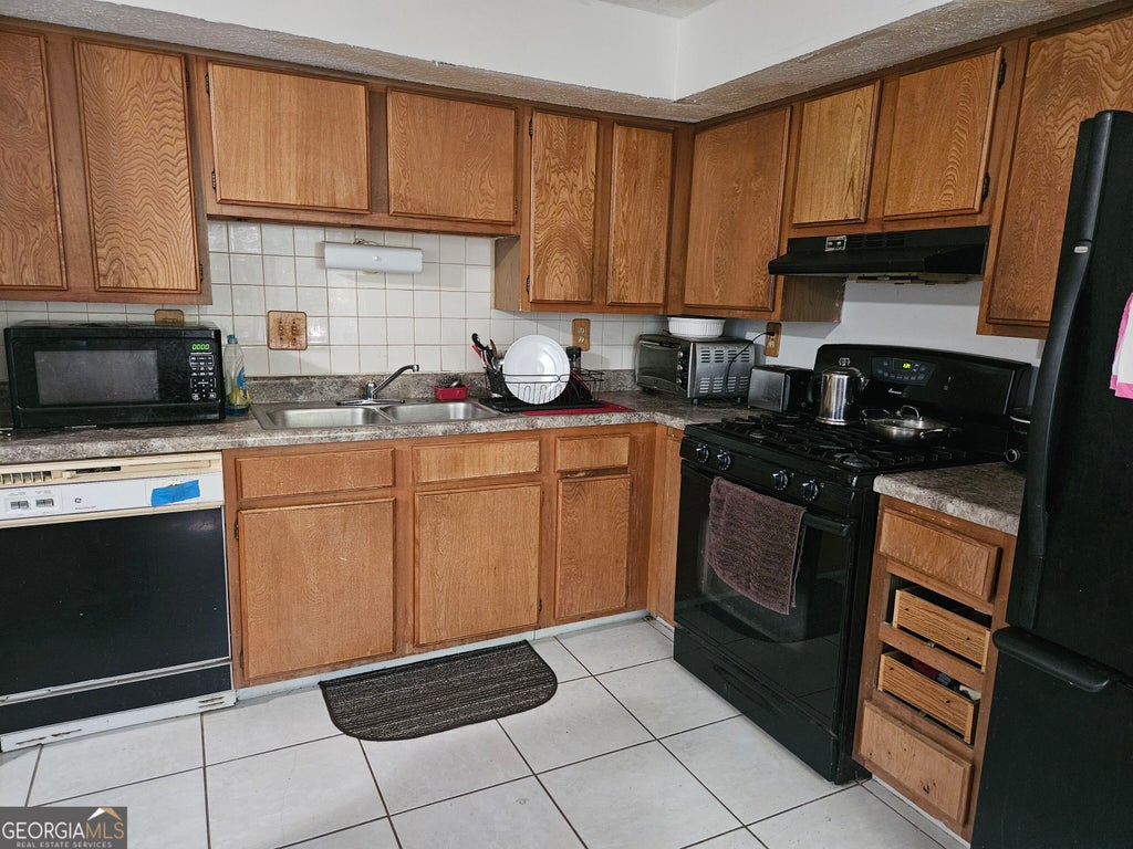 Photo of 5599 Marbut Road, Lithonia, GA 30058 (MLS # 10868425)