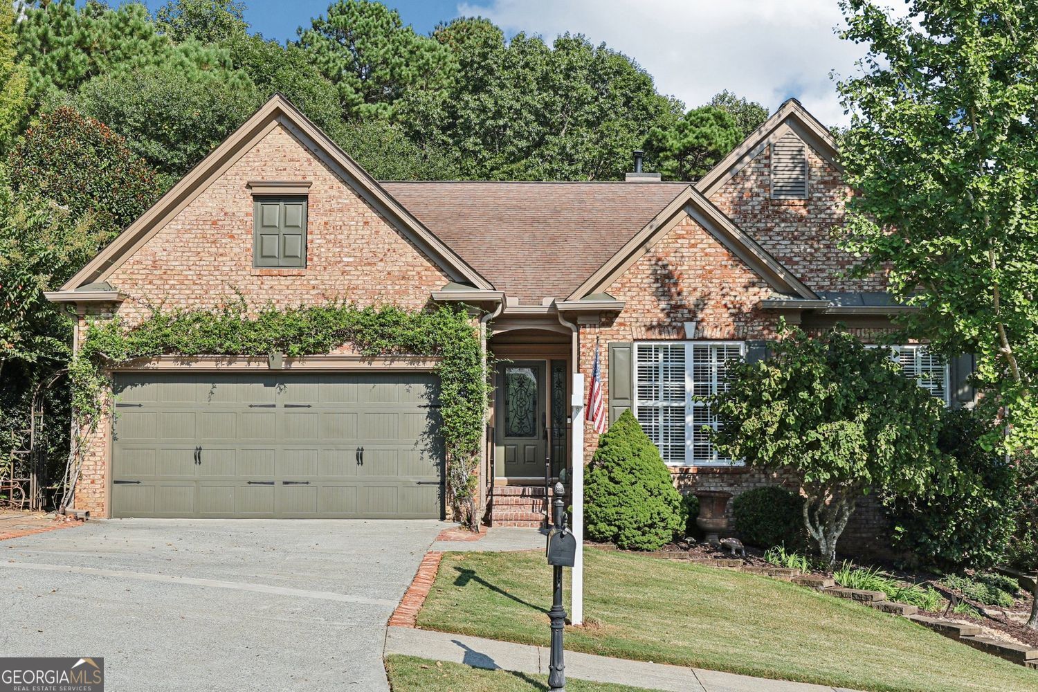Welcome to 103 Whirlaway Place, a charming ranch on a finished terrace level located in the highly desirable swim and tennis community of Brookshire in the heart of Woodstock. This 3-bedroom, 3-bath home offers comfort, convenience, and exceptional amenities in a prime location close to shopping, dining, and vibrant downtown Woodstock. Step inside to find a light-filled family room with a cozy gas fireplace, a first-floor office, and a spacious primary suite on the main level. The kitchen features granite countertops, stainless steel appliances, and newer appliances throughout, with all appliances included. Beautiful hardwood floors, brand-new carpet, and thoughtful finishes make this home move-in ready. Enjoy mornings and evenings on the covered porch overlooking a master gardener's dream - a beautifully landscaped, fenced backyard that backs up to Corps property, ensuring peaceful woodlands and lasting privacy. The finished terrace level expands your living space with a large recreation room complete with a wet bar, a full bath, and an additional bedroom. There's also abundant storage space to keep everything organized. Brookshire offers a true lifestyle community with multiple pools, tennis courts, pickleball, basketball, clubhouse, and parks. With its unbeatable location, natural privacy, and resort-style amenities, this home blends everyday comfort with the best of Woodstock living.