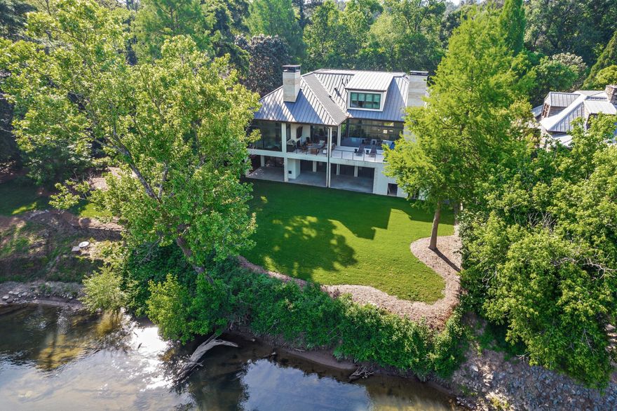 3979 West Paces Ferry is an unsurpassed estate set majestically on the Chattahoochee River in AtlantaCOs exclusive Buckhead neighborhood. Construction was completed in 2020 and one of the last homes constructed with a fifty-foot set back from the river. The home illustrates uncompromising constructions methods Co over 110 helical piers and four feet of concrete.The ground floor garage features room for ten cars through three separate entry doors.Enjoy the serene views of the Chattahoochee River while relaxing in the outdoor entertainment space with a wall mounted flat screen over the fireplace or unwind in the pool or sauna located on the spacious second floor patio. Inside the open floor plan, experience panoramic views and natural light via the floor to ceiling. Twelve foot ceiling heights throughout the main living area provide a spectacular feeling of space. privacy glass. Perfect for entertaining, the kitchen features a Miele microwave, convection, and coffee maker plus two subzero refrigerators and double size wolf range with large stainless vent. The kitchen and bar area also come complete with ice maker, wine fridge and multiple chilling drawers. The master suite is located on the main living floor and features a spacious sitting area with fireplace and floor to ceiling privacy glass with amazing views of the river. With the press of a button, lower your privacy screen and black out the room for a perfect nightCOs sleep. The master bath is expansive with his and hers vanities, enormous shower and sandstone soaking tub. Turn on the whole house entertainment system and listen to your favorite music as you soak in this one of kind tub. Additional spaces on the 2nd floor include guest rooms, laundry and the office complete the second floor living area. Access the elevator to the third-floor suite offering a private living space ideal for guests or extended family members. This suite features a full kitchen, bathroom, and beautiful sleeping area with river views. Other third floor spaces include a fitness/chill room. All mechanical systems including HVAC and whole house generator been raised twelve feet off the ground. The garage has space for ten vehicles and front lot can also accommodate another seven. The home is located 3/10's of a mile from Loveett School and very close to Westminster and Pace. This estate is a riverfront masterpiece and one-of-a-kind opportunity.