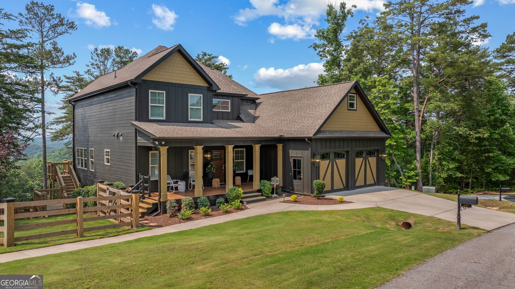 Offering a unique blend of contemporary design and gorgeous mountain views, all located in the gated community the Overlook at Crown Mountain, just minutes from the heart of Dahlonega. This newly renovated home offers an open concept main living space with mountain VIEWS from nearly every room. Upon entering, the unique monochromatic interior welcomes you inside. The kitchen crafted with function and design in mind- an oversized island offers ample workspace while still allowing guests to gather around and enjoy the setting. Exotic granite countertops line the perimeter of cabinetry while the center island offers a contrasting granite for design interest. The dining space can accommodate a long dining table overlooking the view. Just off the dining space, a seamless flow to the living room centered around a custom marble fireplace surround. Enjoy the upgraded light fixtures throughout, with dimmable lighting with nightlight feature found throughout the entire home. The primary suite on the main level is spacious with views. The en-suite showcases marble tile flooring with floor to ceiling tiled shower and separate soaking tub. Upstairs, there is a loft/flex space that serves as a second living space. The two upstairs guest bedrooms have their own private en-suites and walk in closets. On the terrace level, two additional bedrooms with private en-suites and walk in closets are inviting and ready to accommodate guests. The partially unfinished space allows for creativity or function as a workshop and storage. Newly constructed back deck additions offer the perfect space to enjoy the private setting, feeling like your nestled among the mountains and overlooking the fully fenced yard. This property offers an oversized two car garage, with additional parking pad, positioned on a quiet cul-de-sac. Just 2.5 miles from the Dahlonega Square with shopping and dining, University of North Georgia, and convenient to GA 400 access.
