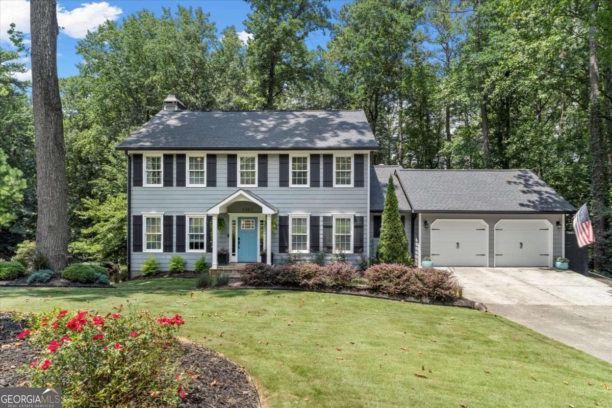 Welcome to this beautifully updated 4-bedroom, 2.5-bath home featuring an additional bedroom and full bath in the finished basement - perfect for guests, a home office, or multigenerational living. Flooded with natural light, this home boasts an open floor plan ideal for both everyday living and entertaining. Gorgeous bay windows along the rear of the home provide lovely afternoon light with a tranquil view of the wooded backyard, the entire living space becomes a peaceful and serene place to relax. Enjoy cooking in the modern, updated kitchen with sleek finishes and plenty of storage with doors to the deck, perfect for grilling! The kitchen is thoughtfully laid out for both functionality and flow, efficient and easy to work in, with higher-end appliances that elevate the entire space. Beautiful quartz countertops, large island, plenty of storage, and fabulous custom wet bar area in the adjacent eating area. You can't miss the large walk in pantry with convenient access to laundry, right off the garage and kitchen area. All bathrooms have been tastefully renovated for a fresh, contemporary feel. The inviting living spaces flow seamlessly onto a large deck overlooking a private, wooded backyard - a tranquil retreat offering both privacy and room to relax or entertain. The finished terrace level features a bedroom and full bath, large recreation area, built in shelving and plenty of storage. Mature hardwood trees and this generous lot layout provides exceptional privacy - a feeling of being tucked away somewhere special while still enjoying the heart of this friendly neighborhood, a welcoming community with a strong sense of connection among neighbors. Located in the top-rated East Side, Dodgen and Walton High school district and just minutes from shopping, dining, and parks this home offers the perfect balance of comfort, convenience, and style. Don't miss this rare, move in ready, opportunity - schedule your showing today!
