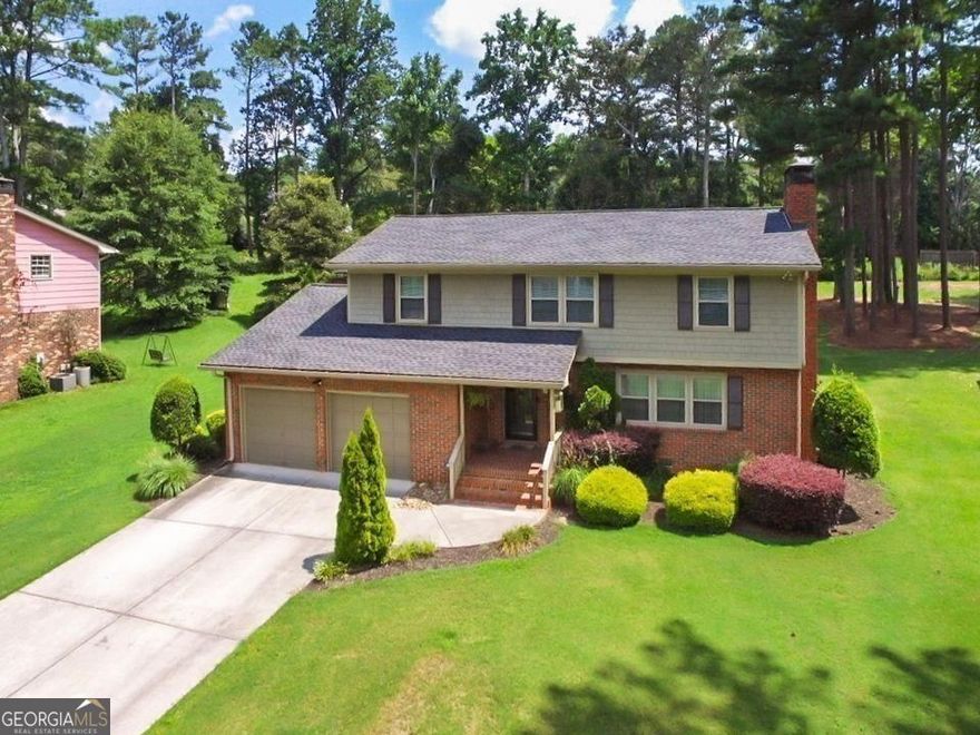 Tucked away from the hustle and bustle in a peaceful suburban setting, yet just minutes from the city. This is the best of both worlds. Welcome to a RARE ONE-OWNER 4 bedroom, 2.5 bath living at its finest, where quality construction meets modern convenience in one of Mableton's most accessible neighborhoods. Just moments from I-285, major shopping, dining, and the scenic Silver Comet Trail, this home delivers the lifestyle you've been searching for. Built to Last, Updated for Today: This home showcases craftsmanship you simply won't find in cookie cutter new builds. Gleaming real hardwood floors and custom trim flow throughout, while recent upgrades ensure worry free living: a 1 year old roof and water heater, plus fully replaced HVAC systems mean major investments are already handled. Thoughtfully Designed Living Spaces: From the inviting formal living room with fireplace to the sunken den that offers a comfortable escape, this floor plan gives you room to spread out and truly live. The remodeled kitchen blends timeless style with functionality, seamlessly connecting your everyday routines with entertaining guests. Retreat Worthy Primary Suite: Upstairs, the generous primary bedroom elevates daily living with elegant crown molding and a completely renovated ensuite featuring a beautiful tiled stand up shower and smart storage solutions. Three additional well proportioned bedrooms plus a versatile fourth room (perfect for a home office, nursery, or hobby space) complete the upper level. Your Private Outdoor Oasis: The oversized, level lot is where this property truly shines. With space for gardens, play areas, or even a future pool, the backyard possibilities are endless. Enjoy your morning coffee on the private rear patio, surrounded by mature evergreen trees that create a serene, natural buffer. A convenient storage shed keeps everything organized. Freedom to Make It Yours No HOA Means No Restrictions: Bring your creative vision to life with chickens, extensive gardens, or any outdoor projects you've been dreaming about. Unbeatable Value: Priced competitively with nearby townhomes, this single family home offers something they can't: actual land, true privacy, and room to grow. Plus, the beloved Fellowship Pool is just a short stroll away for summer fun. Pre inspected and meticulously maintained. This home is move in ready and waiting for its next chapter.