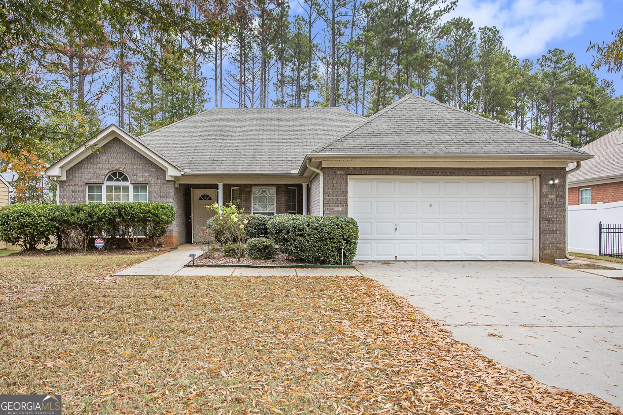 Welcome to this beautifully maintained 3-bed, 2-bath ranch in Fairburn. Built in 2006, this move-in ready home features vaulted ceilings, a cozy fireplace, and over 1600 square feet of one level living. The kitchen features granite countertops, stainless steel appliances, and ample cabinet space. The primary suite includes tray ceilings, a walk-in closet, and a private bath. Outside, enjoy a fully fenced backyard with a patio and storage shed, perfect for relaxing or entertaining. Located in a well-kept HOA community just minutes from schools, shopping, and I-85. Ideal for homeowners or investors. Schedule your showing today. Ask how you can receive up to $500 credit by using one of our preferred lenders. Exclusions may apply.