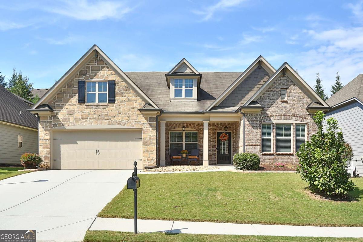 Impeccably maintained and rare to find ranch style home in the ever-popular Riverbend at Mulberry neighborhood. On arrival, you will be greeted by a welcoming front porch and exceptional curb appeal. Upon entry, gleaming wood floors and a deceivingly expansive floor plan are sure to delight. Off the foyer is flex space, currently used as an office and a half bath for guests. The open concept kitchen is an entertainer's dream with a massive island and dining area that overlooks the great room and office nook. Coffered ceilings, impressive molding detail and fireplace punctuate the space. The split bedroom plan features two secondary bedrooms with a full bath on one side of the main floor. Prepare to be amazed by the primary suite with luxurious spa-like bath, custom tile work and oversized shower with dual showerheads. Beyond the walk-in closet is access to the laundry room for added convenience. Upstairs is the fourth bedroom with a full bathroom providing endless possibilities for use. Enjoy your morning coffee or fall football afternoons on the screened porch with fireplace overlooking the beautifully landscaped, fenced back yard. Riverbend at Mulberry is an amenity driven community in the heart of Braselton. Conveniently located near restaurants, the hospital, shopping and easy access to both 85 and 985.