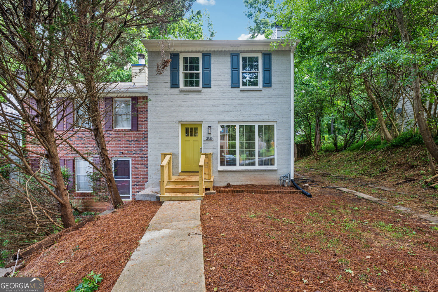 This beautifully updated end-unit townhome features brand-new finishes throughout. BRAND NEW ROOF, HVAC, AND PLUMBING! Enjoy durable LVP flooring on the main level and plush new carpet upstairs. Large Living Room with a decorative brick fireplace and brand-new windows on either side. Tons of natural light! The kitchen is fully renovated with all-new cabinetry, granite countertops, and stainless steel appliances. Just off the kitchen, step out to a private patio overlooking the massive fenced backyard-ideal for entertaining, pet, and kids. Upstairs there are two large bedrooms which share a fully remodeled bathroom with granite countertops and a brand-new tub/shower and vanity. Located just 5 miles from I-75, with quick access to downtown Smyrna (10 minutes), Marietta Square (14 minutes), and Truist Park/I-285 (15 minutes). No HOA and no rental restrictions-perfect for homeowners and investors!