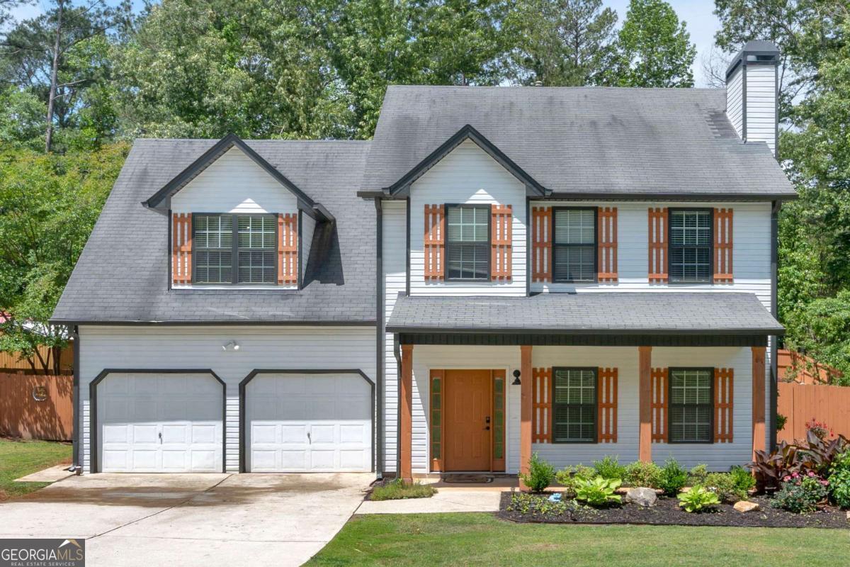Welcome to 40 Polo Crossing, a beautifully updated 4-bedroom, 2.5-bath craftsman home in the desirable Lexington Farms community. Built in 2005 and set on nearly a half-acre lot, this property offers the perfect combination of space, privacy, and peace of mind. This home may qualify for a first-time buyer program through a preferred lending partner, allowing eligible buyers to put just 1% down with a 2% grant to boost their buying power. Programs like this make homeownership more attainable and add instant value from day one. In 2023, the exterior was refreshed with custom wood shutters, stylish pillar covers, and a new privacy fence, all surrounded by professional landscaping that enhances the home's curb appeal. The fenced backyard feels larger than a half-acre and creates a quiet setting for entertaining, gardening, or simply unwinding. Just off the kitchen, a covered back deck extends your living space outdoors, making it easy to enjoy the peaceful surroundings year-round. Inside, the bright and open floor plan features durable luxury vinyl plank flooring throughout the main level, blending style with easy maintenance. A welcoming foyer leads to spacious living and dining areas filled with natural light and designed for both everyday comfort and hosting guests. Upstairs, the well-appointed bedrooms provide flexibility for any lifestyle, including a generous primary suite with plenty of room to relax. Thoughtful updates and timeless finishes make this home truly move-in ready. Conveniently located near shopping, dining, parks, and local attractions, this home offers the ideal balance of suburban tranquility and everyday convenience. With no HOA, you'll appreciate the freedom to enjoy your property as you wish while still being part of a well-kept community.