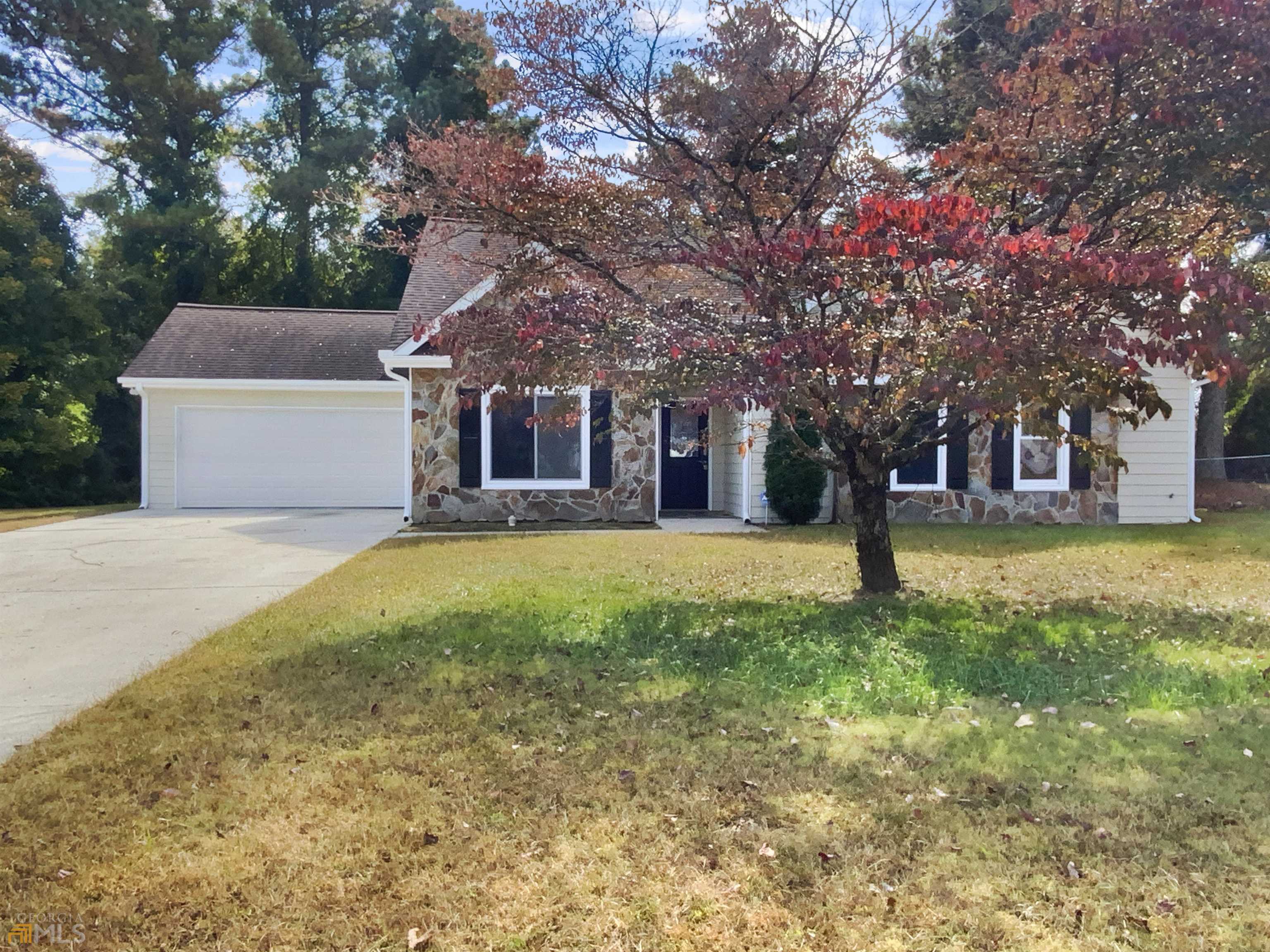 This Loganville one-story home offers a patio.