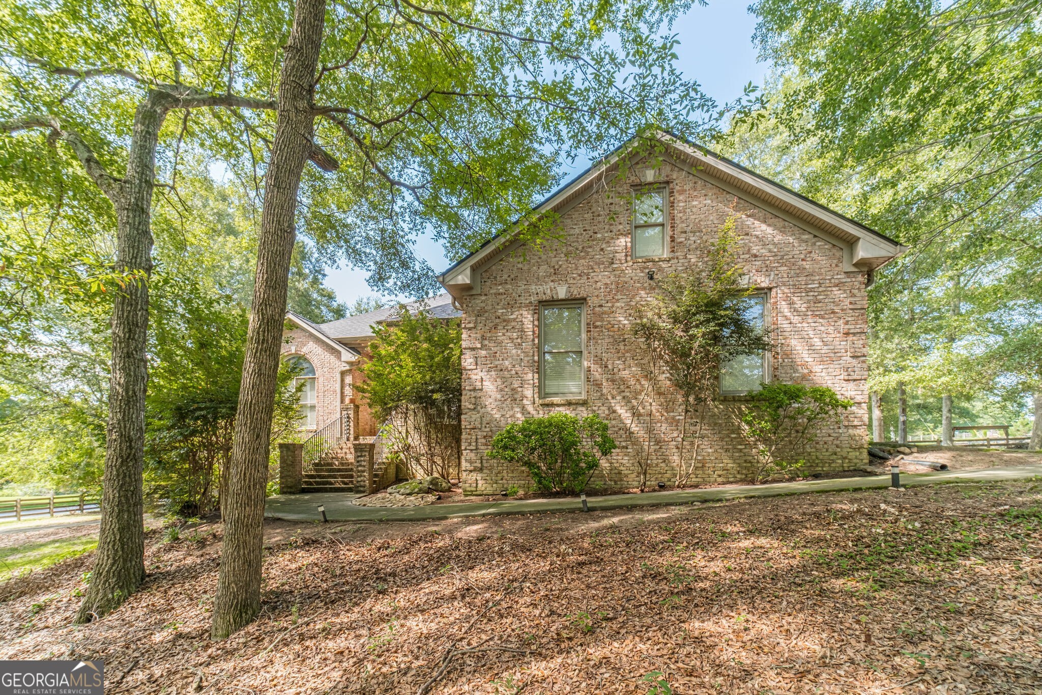 Welcome to this one-of-a-kind ranch nestled on a sprawling 2.1-acre lot. This spacious 5-bedroom, 3.5-bathroom home offers a life of comfort and tranquility within the coveted Loganville High School cluster. As you step inside, you'll be greeted by a generous floor plan that features an oversized Owner's Suite on the main level, complete with a gigantic walk-in closet, dual vanities, and a jetted tub. The split bedroom plan ensures privacy and convenience for all members of the household. HUGE bonus room upstairs, perfect for entertainment, a home office, or a cozy family retreat. Additionally, the finished Basement Apartment is an absolute gem offering a full kitchen, bathroom, bedroom, its own private driveway, garage, and patio - ideal for extended family, guests, or even as a rental opportunity. Stay comfortable year-round with a brand new HVAC system and enjoy peace of mind with a newer roof overhead. The back deck, oversized and adorned with a charming pergola, invites you to unwind or host gatherings. With a fenced backyard that offers endless possibilities, you can let your imagination run wild, creating your own personal outdoor oasis. And with a four-car parking space, there's plenty of room for vehicles and storage. Conveniently located to Shopping, Dining, Interstate 20, Athens & Atlanta. Don't miss the chance to make this your new home.