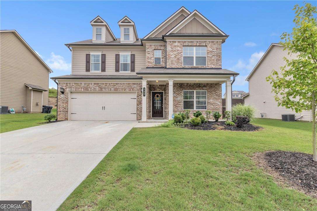 Located in one of Loganville's most desirable communities, this beautiful 4-bedroom, 3-bath home offers a highly functional layout designed for comfort and style. The main level includes a guest suite with a private bath, an open-concept living area, and a modern kitchen with granite countertops, stainless steel appliances, and a large island. Upstairs features a spacious loft perfect for a second living room or office, a luxurious primary suite with a tray ceiling, a spa-like bathroom with double vanities, a walk-in shower, and a huge walk-in closet, along with two additional bedrooms and a full bath. Built in 2021 and in excellent condition, the home feels like nearly-new construction. Enjoy a fully fenced backyard with a covered patio ideal for gatherings. Conveniently located near top-rated schools, shopping, dining, parks, and with quick access to US Highway 78 and GA Highway 20. The community offers sidewalks, a swimming pool, and an affordable HOA. This home blends modern comfort, prime location, and a family-friendly neighborhood-ready for its next owner.