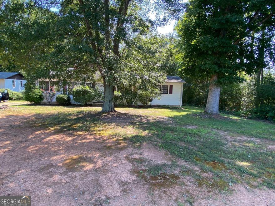 4+ acres of land in City of Milton.  2bed/1bath home is currently rented, please do not disturb tenants, call for appointment to view