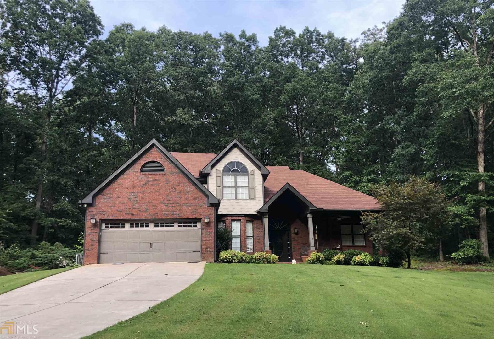 Hard to describe this home with words. Total privacy on a large 3 acre culdesac lot. 4 sides brick home with detached brick 3 car garage with unfinished bonus room. Beautiful master bedroom on the main floor, all other bedrooms upstairs. Separate dining for entertaining guest. Outside brick and rock accents galore. Outside features a pergalo and built in gas grill. Don't take my word for it, come see yourself. Country living at it's finest!!