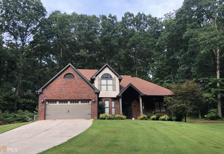 Hard to describe this home with words.  Total privacy on a large 3 acre culdesac lot. 4 sides brick home with detached brick 3 car garage with unfinished bonus room.   Beautiful master bedroom on the main floor, all other bedrooms upstairs.  Separate dining for entertaining guest.  Outside brick and rock accents galore.  Outside features a pergalo and built in gas grill.  Don't take my word for it, come see yourself.  Country living at it's finest!!