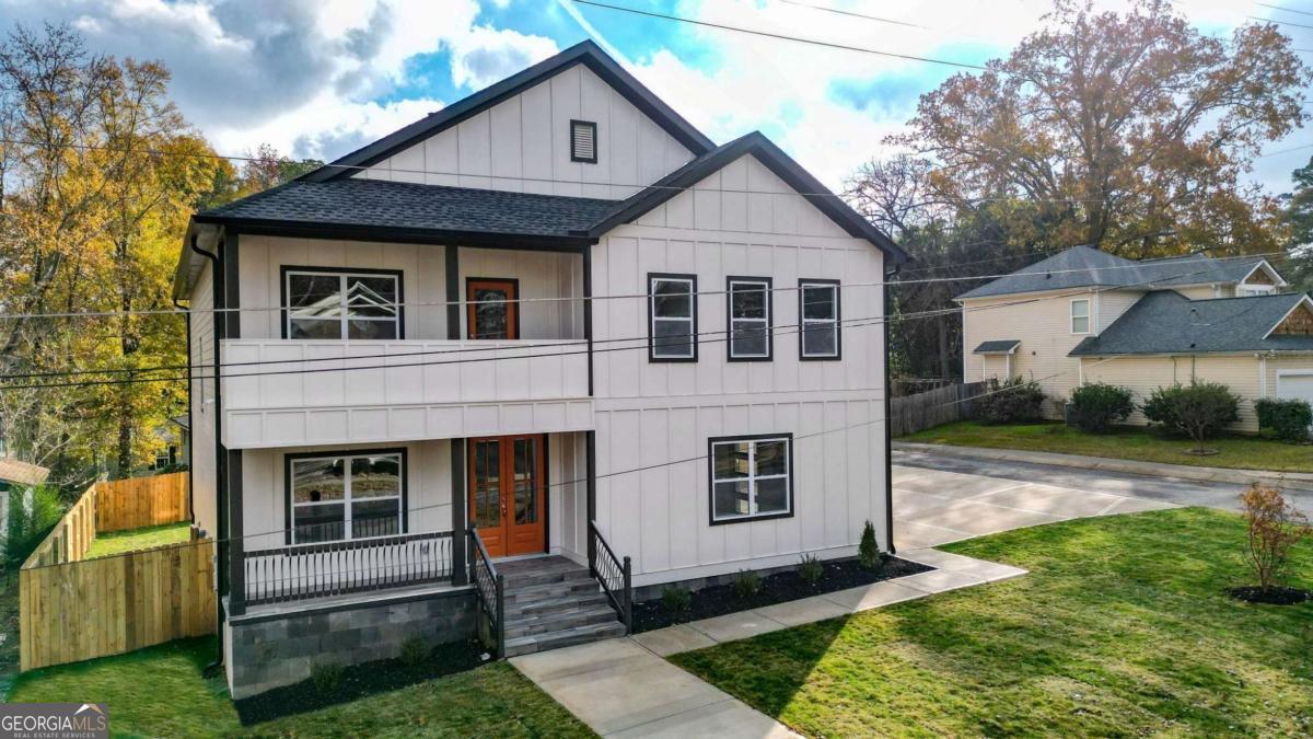 Welcome to your dream home located in Historic Downtown Acworth! This stunning new construction blends modern elegance with small-town charm, offering both comfort and convenience. Situated in a golf cart-friendly community with NO HOA, residents also enjoy a private pass to Acworth Beach and Cauble Park. Set on a desirable corner lot, the home spans 3,400 square feet of thoughtfully designed living space. The main level features an open concept layout where the gourmet kitchen, dining area, and living room flow seamlessly together, perfect for entertaining or everyday living. A private office with a nearby full bath provides flexibility for guests or remote work. Upstairs, retreat to the oversized primary suite, complete with a luxurious ensuite bath designed for relaxation. Three additional bedrooms and two full bathrooms provide comfort and privacy for family and guests. Outdoor living is a highlight with a covered front and rear porch as well as an upstairs balcony, offering plenty of space to relax and entertain. With high-end finishes, quality craftsmanship, and a prime location just minutes from Lake Acworth, this home offers the perfect balance of style, convenience, and lifestyle perks. If you are seeking a home that combines modern living with historic charm, this is it. Schedule your private tour today and experience the best of Acworth living. PREFERRED LENDER OFFERING COMPLIMENTARY RATE BUY DOWN AND FREE APPRAISAL FOR QUALIFIED BUYERS.