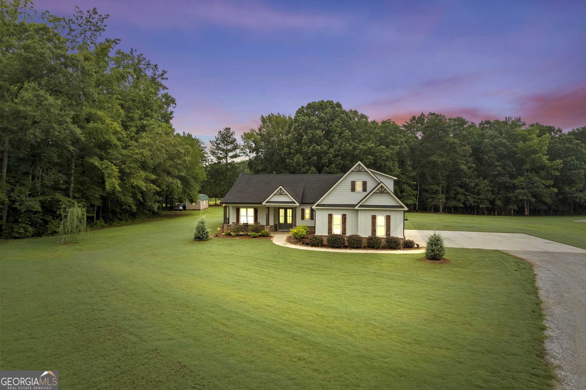 The Gail floorplan, 4 BR/3 BA beautiful Farmhouse Ranch style home on 4.61-acre lot. This home is built on a slab with beautiful features including a brick water table on front, side entry garage with opener, 30 Year architectural shingles, 5" gutters. Kitchen with beautiful white cabinets, island, farmhouse sink, granite countertops, beautiful GE stainless-steel appliances including a range, dishwasher, AND refrigerator. Formal Dining Room, Spacious Living Room with fireplace with gas logs, brick accent wall and open concept plan, Office, split bedroom plan, finished bedroom with full bath upstairs, ceramic tile flooring in baths, lvp flooring in all areas except bedrooms. Laundry Room has two entrances; one opens to the Master closet which leads into the Master Bathroom and second from the hallway.  Master bathroom has his/her split double vanity, stepless shower, covered rear back porch area, Hardi plank siding. Home has a propane tank for heat, fireplace, cooking and the water heater. This home features stepless showers in both the Master Bathroom and Hall bathroom and has extra wide door casings. 10 ft ceilings on main, 8ft. doors and 6 ft windows. Large storage building in the back will remain. Closing attorney is Bagby Law in Dallas, GA.