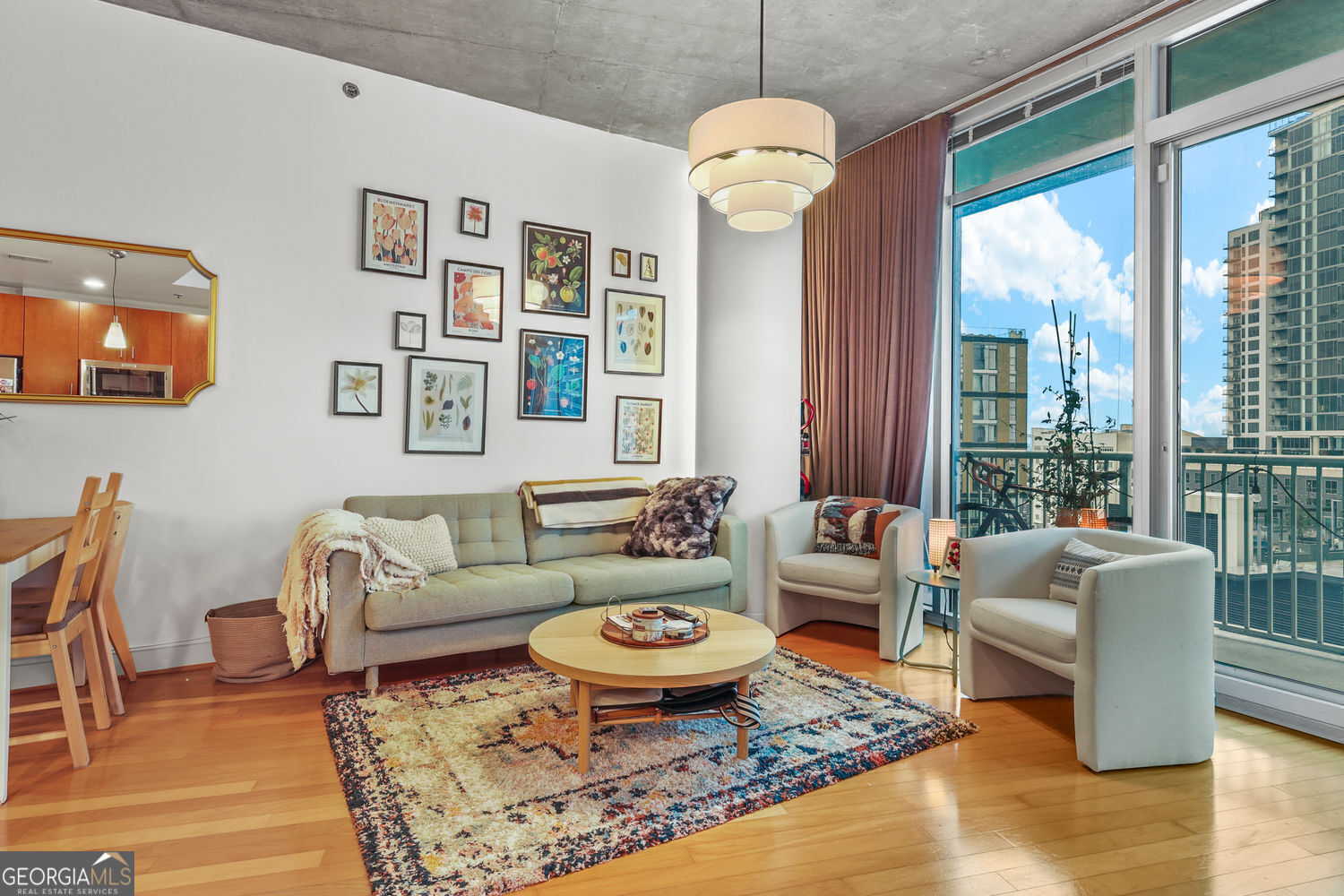 You must see this gorgeous, FURNISHED 12th floor condo at popular Plaza Midtown. This unit is the large one bedroom plan and offers an office nook in addition to great living and storage space. Floor to ceiling windows and sliding glass doors in the living room and bedroom bring in City views and great natural light. Situated in the middle of all that Midtown Atlanta has to offer, this location can't be beat. Some of the hottest restaurants, night spots, shopping and Marta are just outside of the main door of this condo. In addition you can take the elevator directly to the Midtown Publix located on the ground floor of the building. How convenient is that? Features of this beautiful unit include hardwood floors, floor to ceiling windows w/ curtains/shades from the Shade store, open kitchen w/ new stainless steel appliances, granite countertops & breakfast bar, double sliding glass doors to an extra large covered patio w/ west facing views, fresh paint & updated light fixtures throughout, new Nest thermostat, built-in office nook w/ shelves & designer wall paper, ceramic tile bath w/ garden tub, new faucet & toilet, new washer/dryer, mirrored closet doors, assigned garage parking and more. Amenities of Plaza Midtown include resort like pool & grounds, newly furnished club room, gym w/ Pelotons, covered dog walk area/dog wash station, bike storage, fire pit & grill areas & concierge. Schedule an appointment to tour this beautiful unit today! All furnishings remain except the artwork.