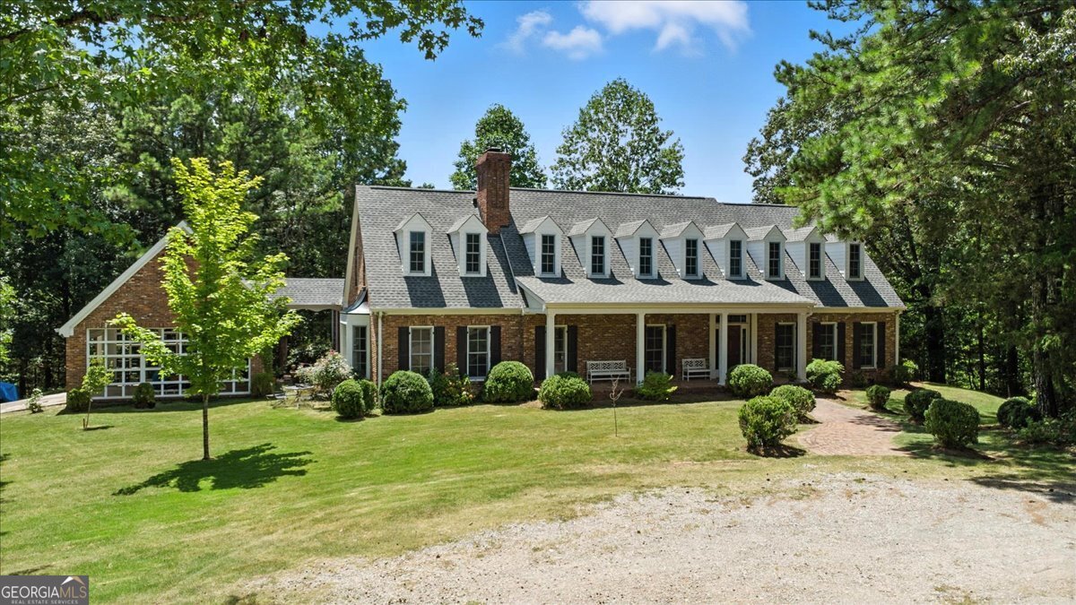 Welcome to this stunning custom built home, nestled in the serene hills of Rome, Georgia. Originally constructed in 1990, this unique property offers both comfort and character across an expansive layout. Features include 4,800 square feet of finished living space, 2,000 square feet of unfinished basement/bonus area, 3 spacious bedrooms, 3.5 bathrooms, and 2 elegant fireplaces for warmth and ambiance. Architectural highlights include custom construction with quality craftsmanship, high ceilings with beams in living area, and several large windows providing an abundance of natural light and panoramic view of the valley. Upstairs includes a bonus room with fireplace and sweeping views, perfect for a study, lounge or creative space. Total acreage is 12.12 acres across 2 parcels, 7.82 acres with home and an additional 4.3 acres ideal for future development or maintained for added privacy. The property is surrounded by undeveloped land and frequented by local wildlife, including deer and turkey, perfect for nature lovers seeking peace and seclusion. This property blends timeless charm with practical space for everyday living. Whether you're entertaining guests by the fireplace or enjoying the tranquil scenery from the upstairs retreat, this home is truly one of a kind. Don't miss this opportunity to own a piece of Rome's beauty!