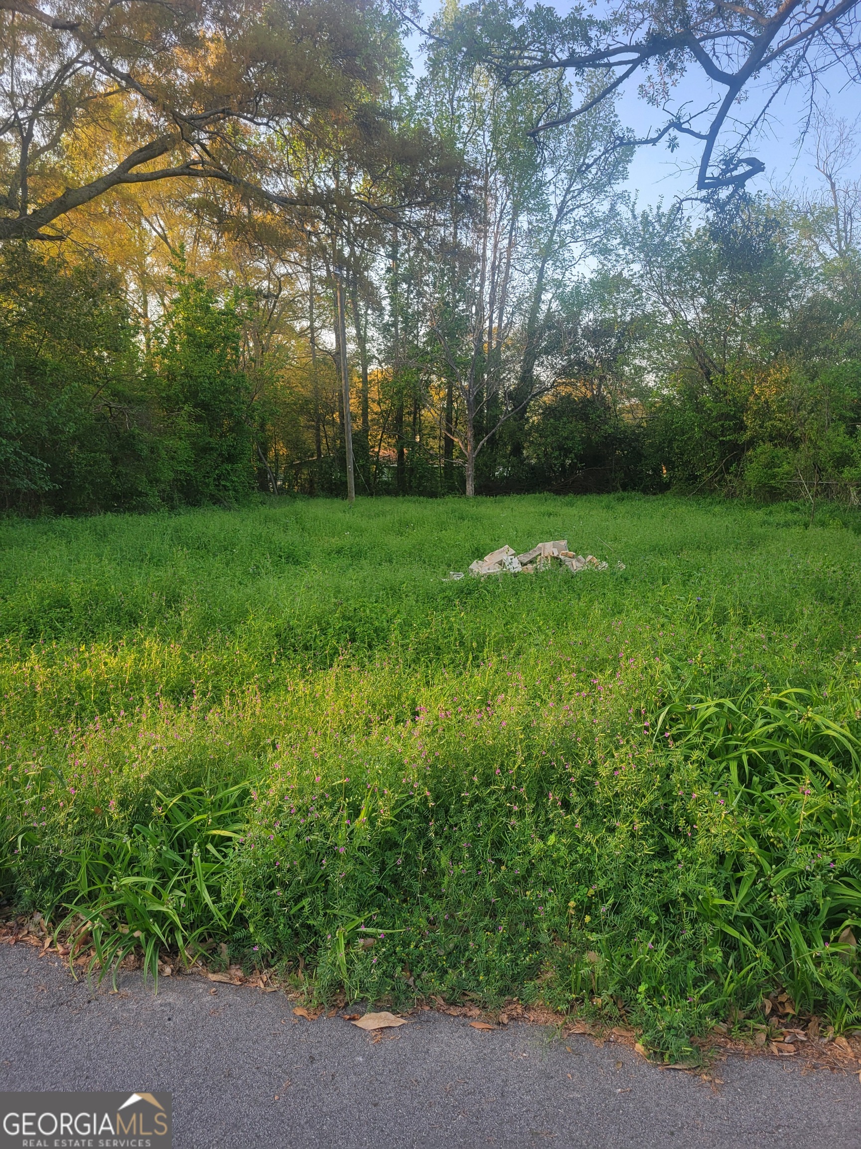 This 0.22-acre (approximately 9,750 square feet) vacant lot is located in the City of McDonough, within Henry County. Zoned R3 (Residential), the parcel offers excellent potential for the development of a single-family residence in a growing and well-established neighborhood. Zoning Information: Zoning Classification: R3 (Residential) Minimum Lot Area: Varies by local ordinance (verify with city/county) Lot Frontage: Approximately 75 feet Lot Depth: Approximately 130 feet Not located within a flood zone (Flood Zone X) Surrounding Area: The lot sits within a residential community with a mix of new construction and older single-family homes. Conveniently located near downtown McDonough, local schools, parks, and shopping centers, it offers an ideal setting for future development. Utilities and Infrastructure: While utility connections are not specified, nearby developed homes typically have access to electricity, water, and sewer. Buyers should verify availability and connection requirements with local utility providers and the City of McDonough. Development Potential: This lot is suitable for building a single-family detached home in compliance with R3 zoning guidelines. Its level topography and central location make it a prime candidate for infill development or investment. Additional Notes: Buyers are encouraged to conduct due diligence with the City of McDonough Planning & Zoning Department regarding development regulations, building requirements, and utility access. A boundary survey is recommended to confirm dimensions and identify any easements. See DOCUMENTS for legal description and property record.