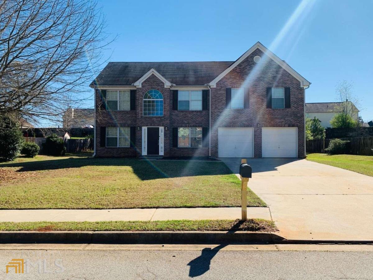 Welcome to this stunning 4 bedroom, 2.5 bathroom home located in the amenity filled community of Holly Hills in Covington! You will love the open floor plan eat in kitchen and family room that has plenty of natural light, countertop space and SS appliances. On the main floor you will also find a formal living room or flex room and dining room! All 4 bedrooms are conveniently located upstairs! The large master suite features a vaulted ceiling, walk in closet, dual sink vanity, soaking tub and separate shower. All secondary bedrooms are ample in size and have vaulted ceilings! This home is only minutes to Newton High School, I20, shopping and so much more! Must see!